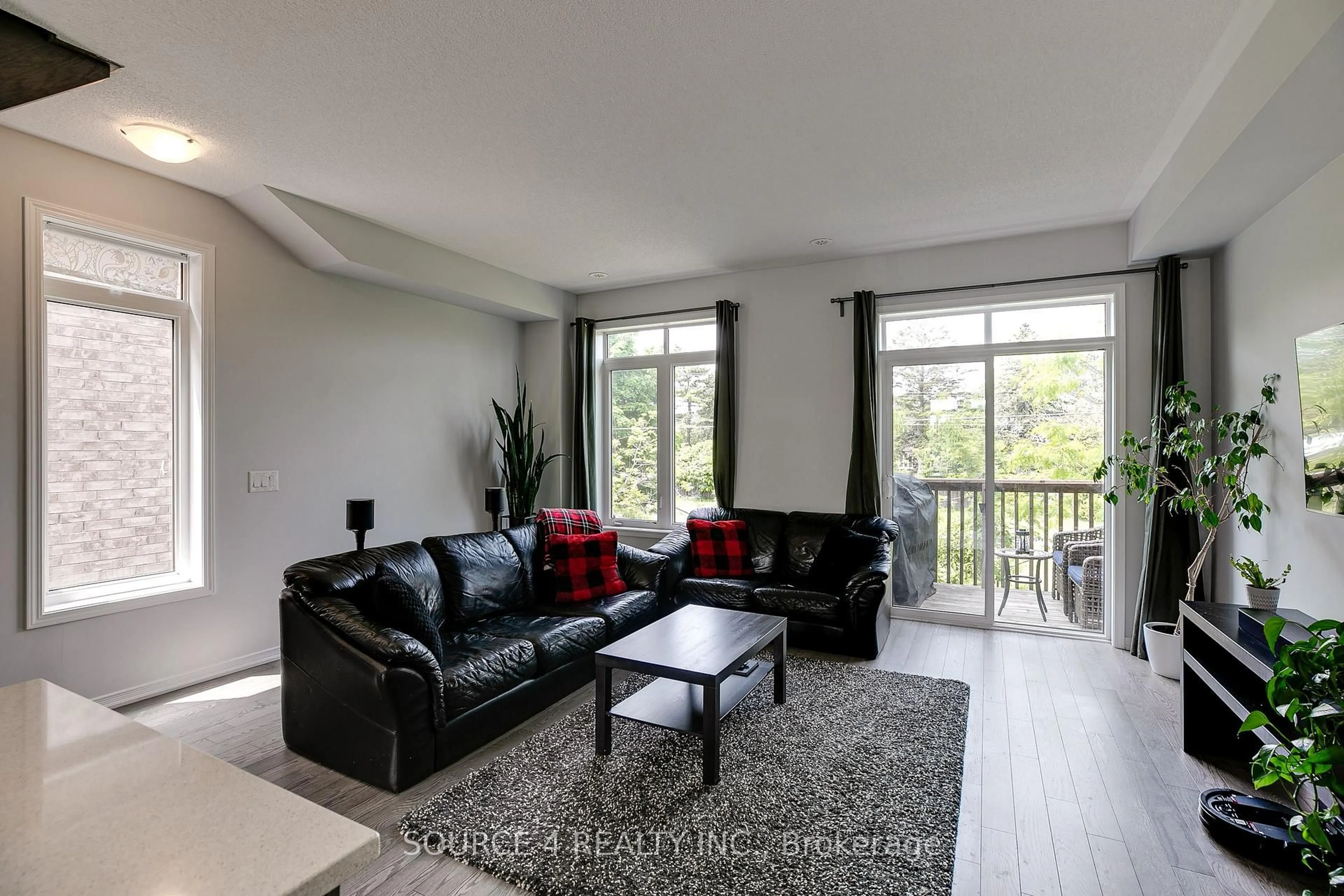 Living room with furniture, wood/laminate floor for 379 Ladycroft Terr #14, Mississauga Ontario L5A 3N8