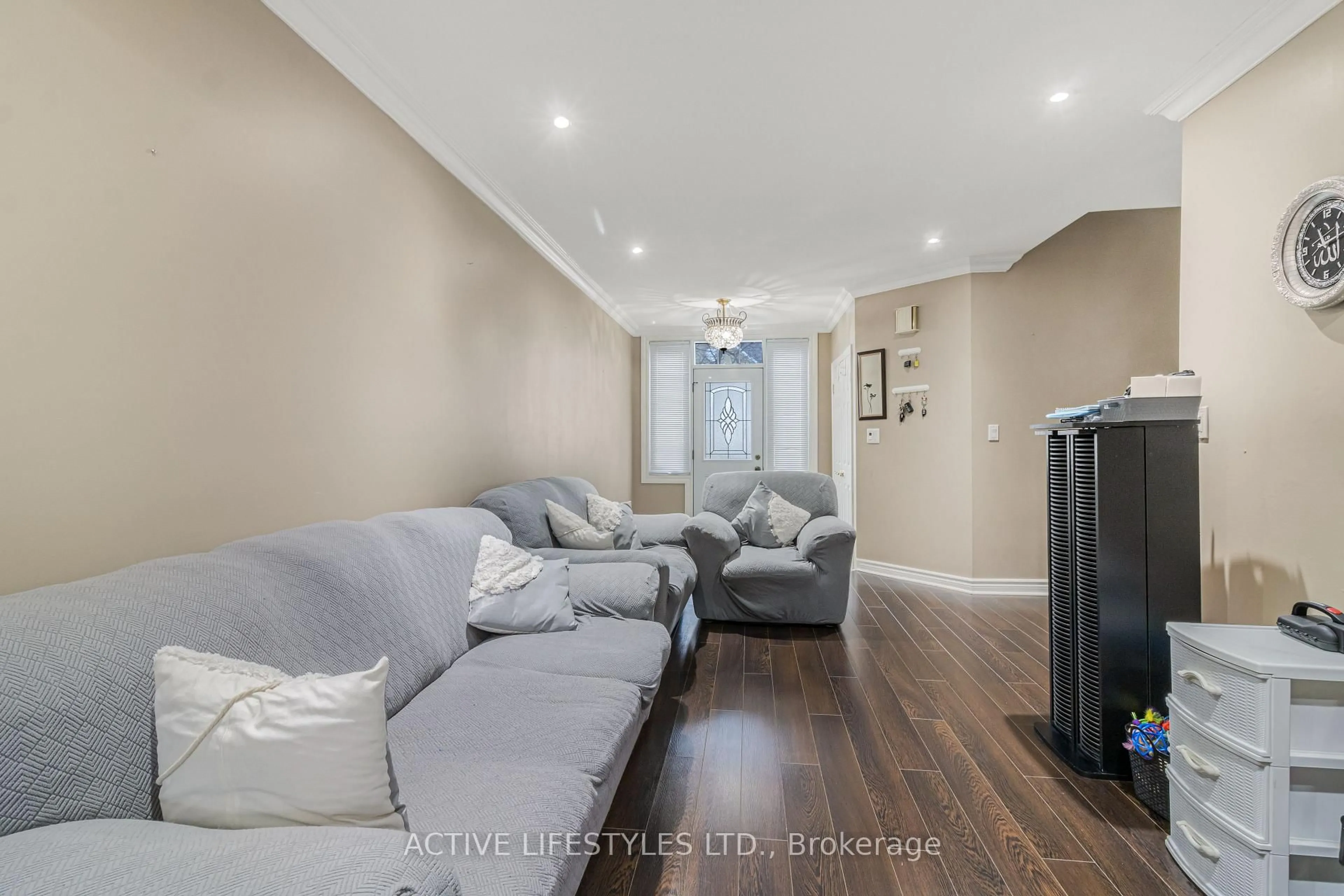 Living room with furniture, wood/laminate floor for 10 Hartnell Sq #59, Brampton Ontario L6S 5W7