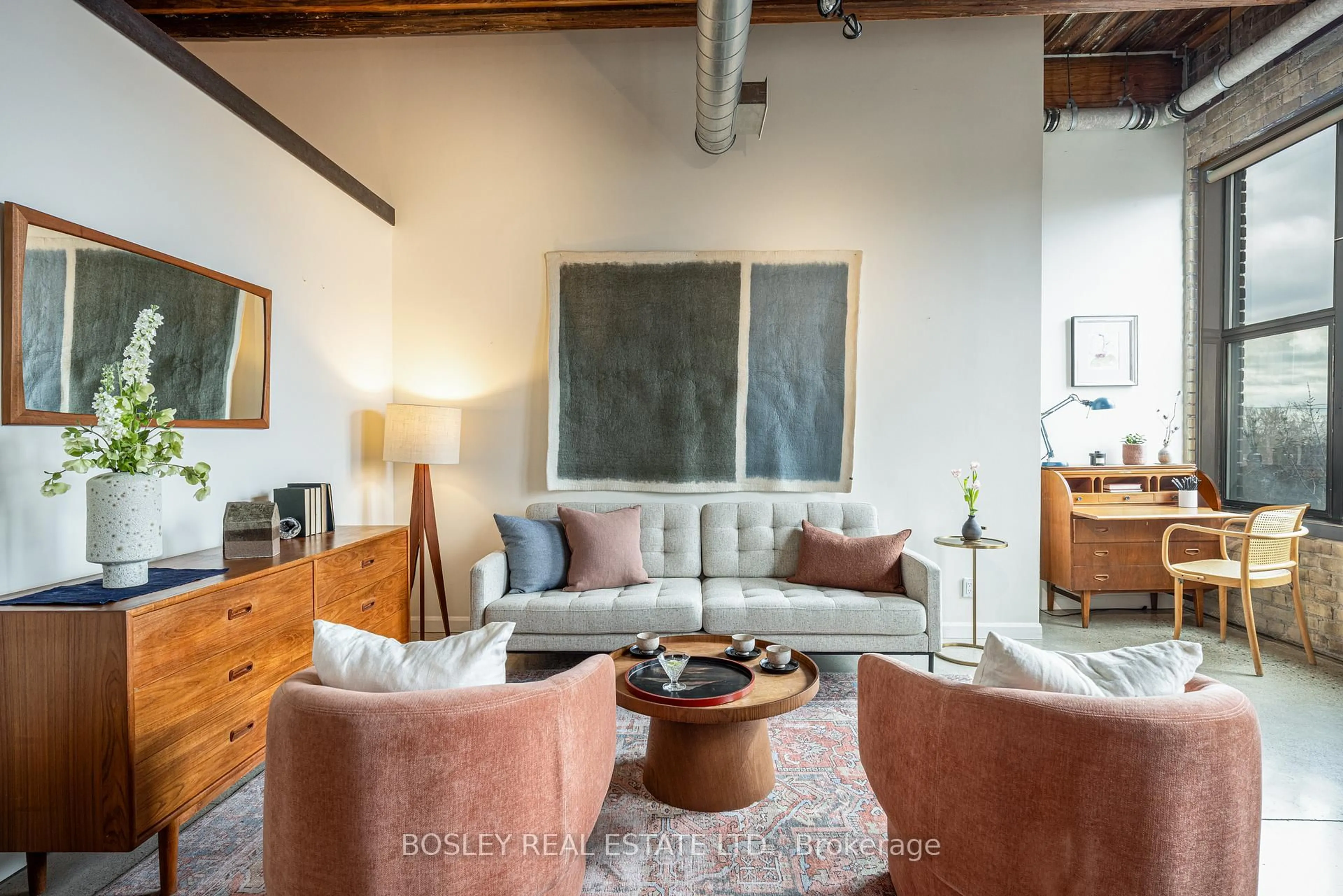 Living room with furniture, cement floor for 363 Sorauren Ave #309, Toronto Ontario M6R 3C1