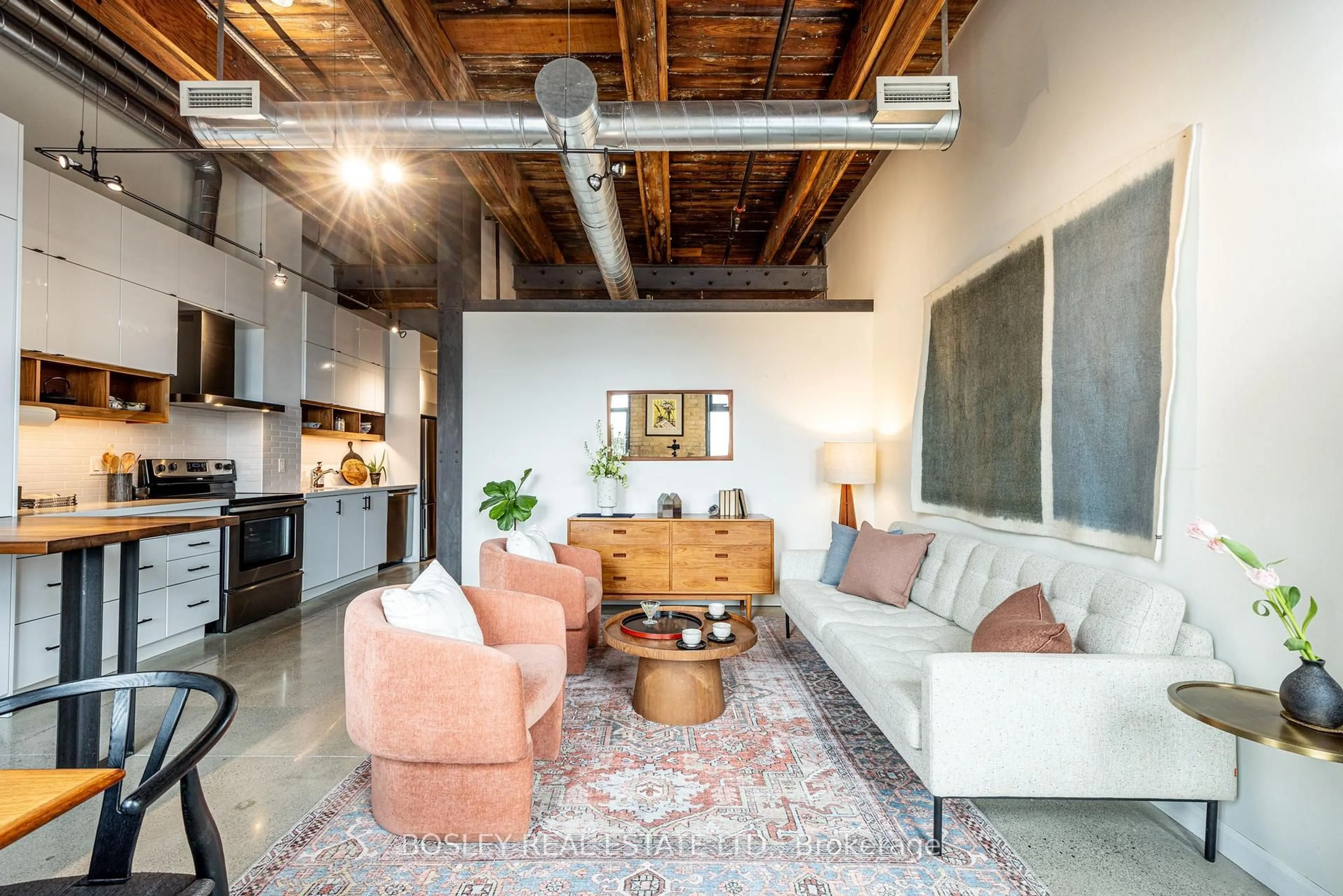 Living room with furniture, cement floor for 363 Sorauren Ave #309, Toronto Ontario M6R 3C1