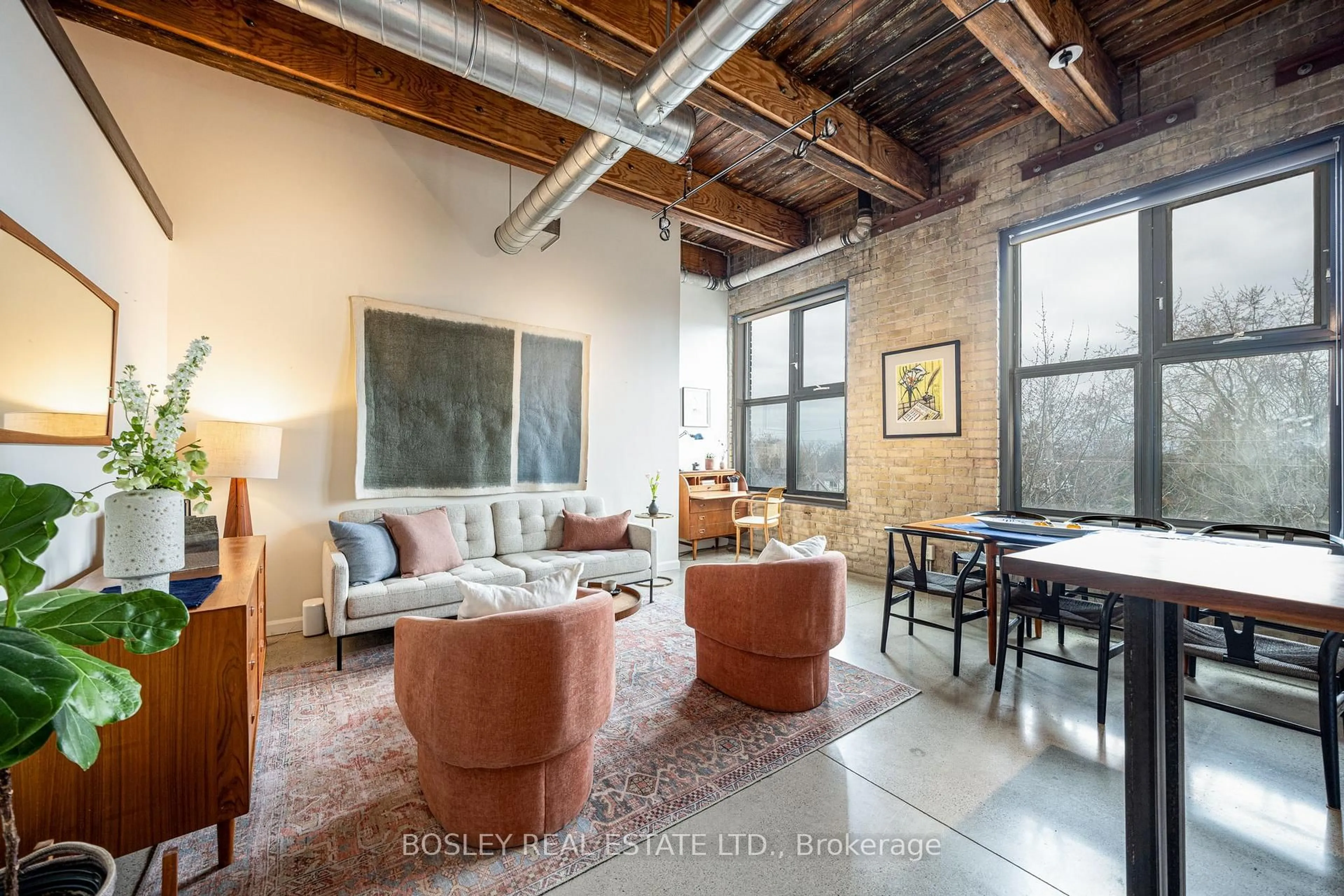 Living room with furniture, cement floor for 363 Sorauren Ave #309, Toronto Ontario M6R 3C1