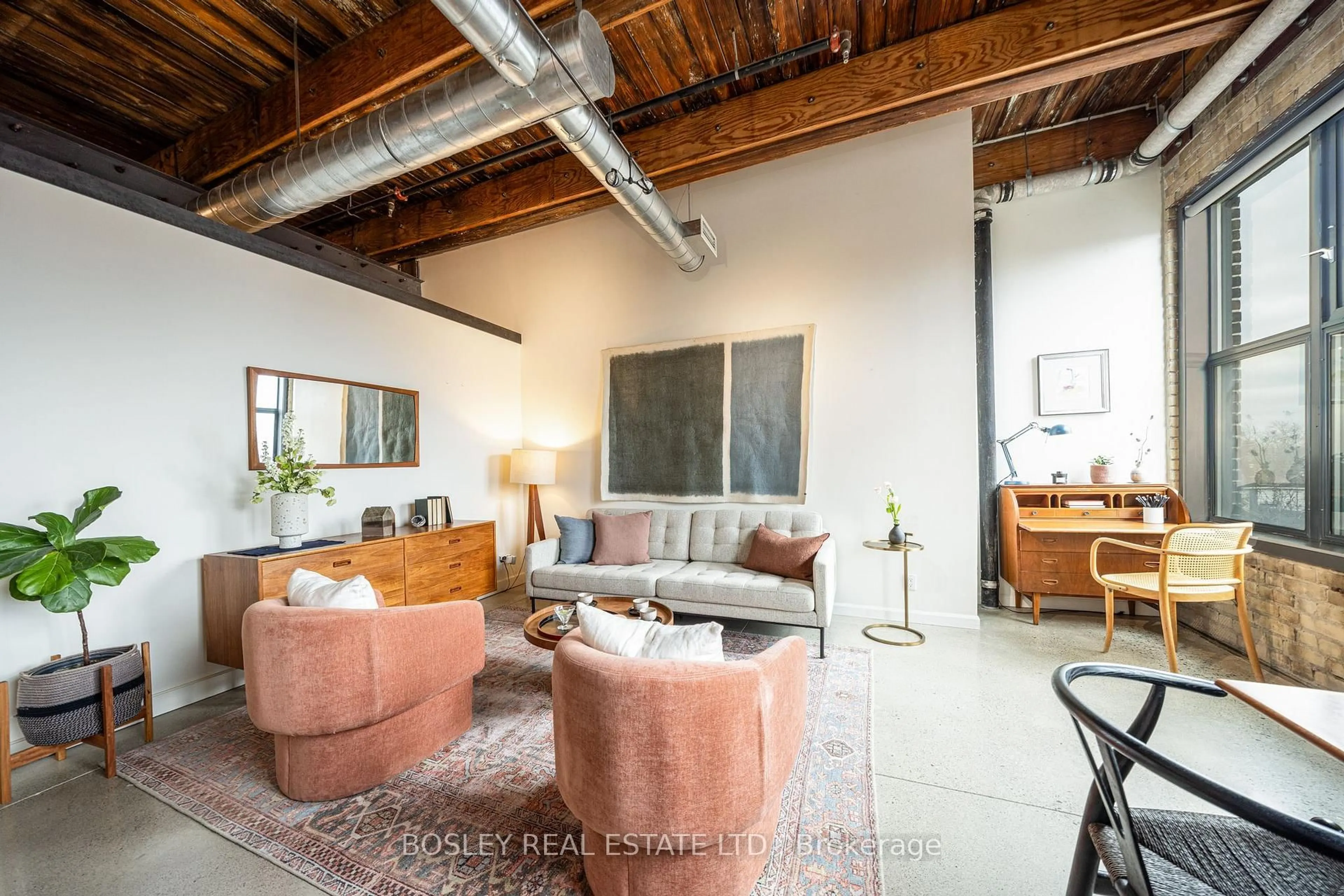 Living room with furniture, cement floor for 363 Sorauren Ave #309, Toronto Ontario M6R 3C1