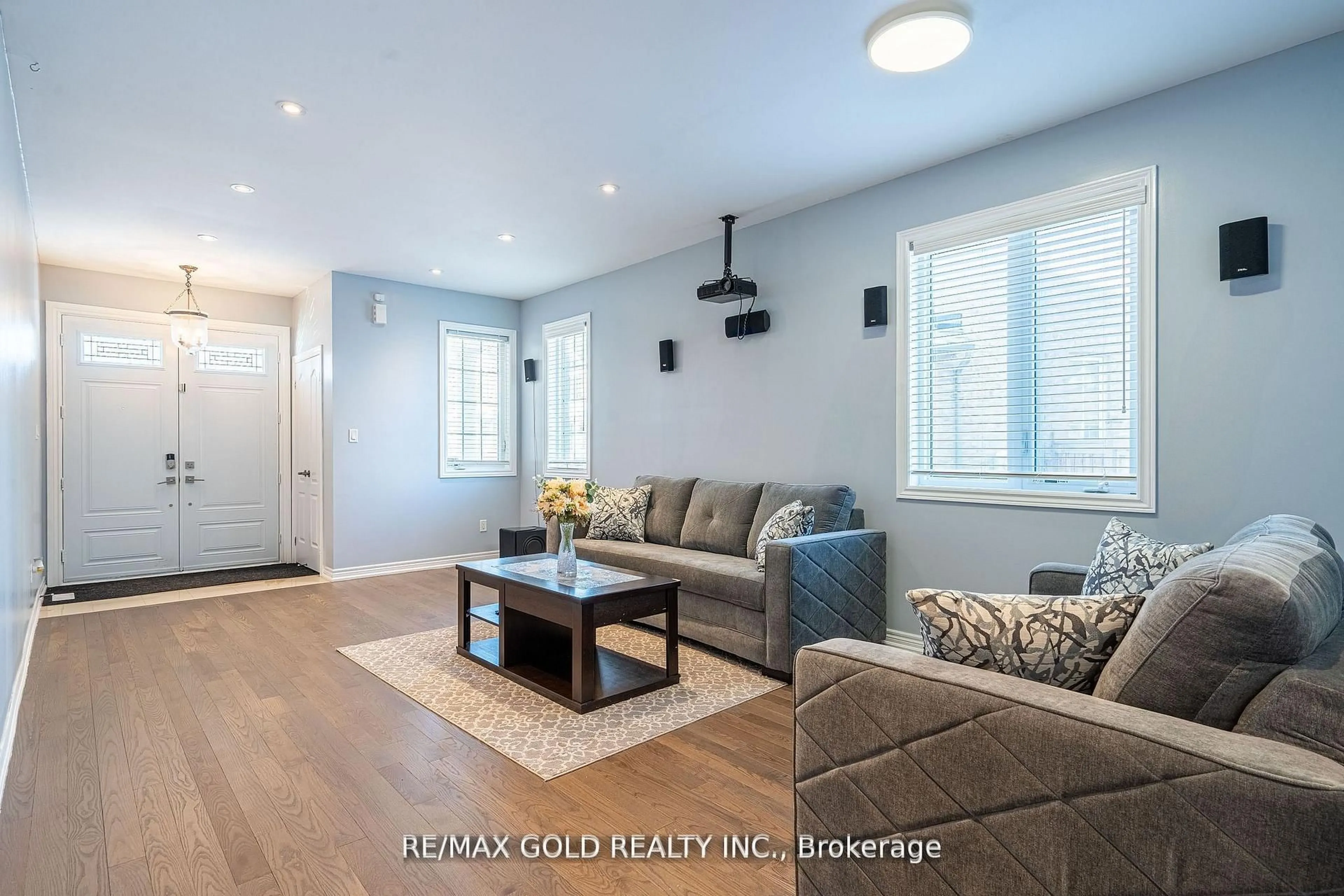 Living room with furniture, wood/laminate floor for 10 Spokanne St, Brampton Ontario L6R 4A2