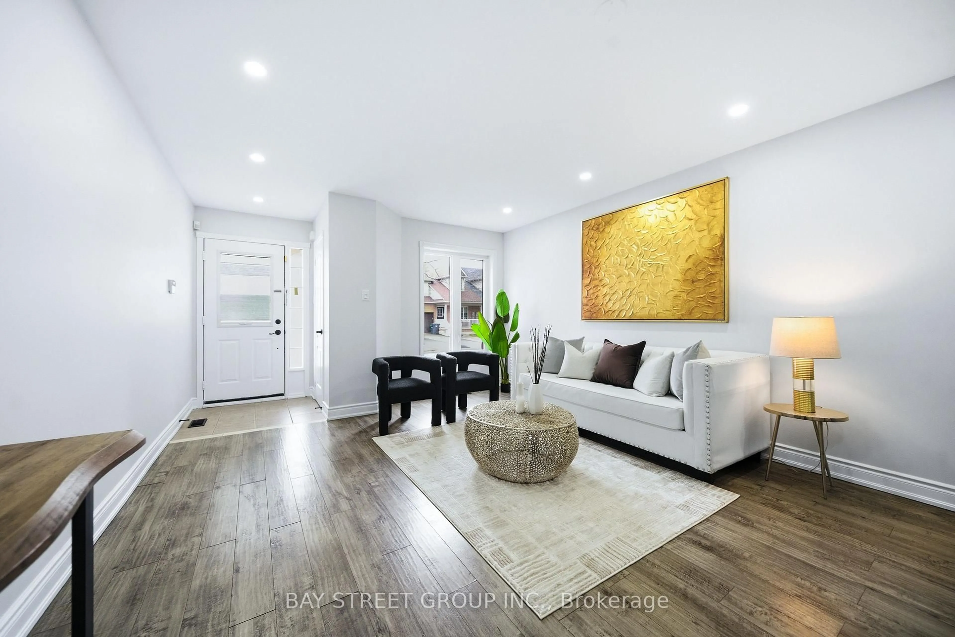 Living room with furniture, wood/laminate floor for 48 HEARTLEAF Cres, Brampton Ontario L7A 2B7