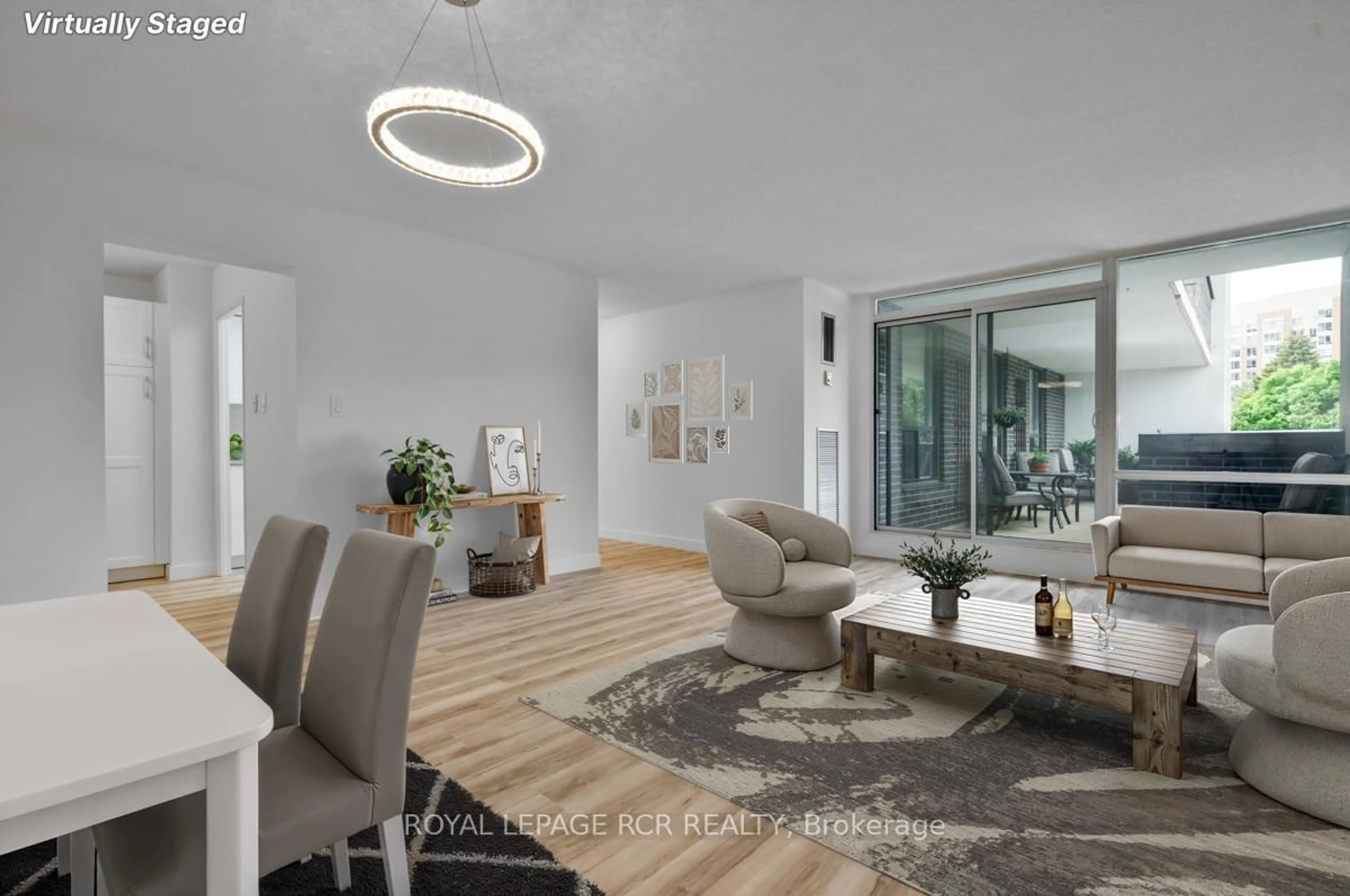 Living room with furniture, unknown for 1535 Lakeshore Rd #205, Mississauga Ontario L5E 3E2