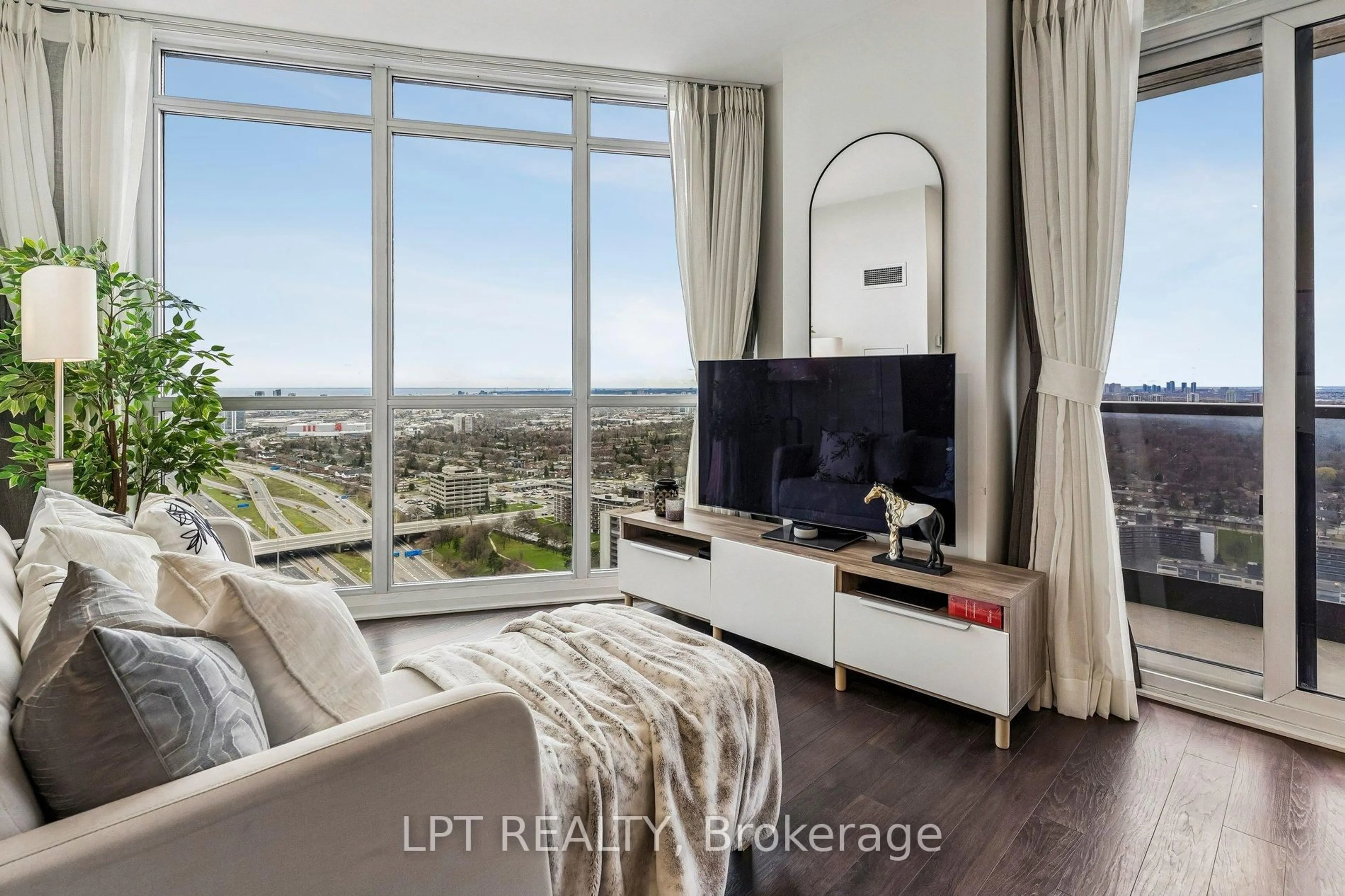 Living room with furniture, wood/laminate floor for 5 Valhalla Inn Rd #3105, Toronto Ontario M9B 0B1