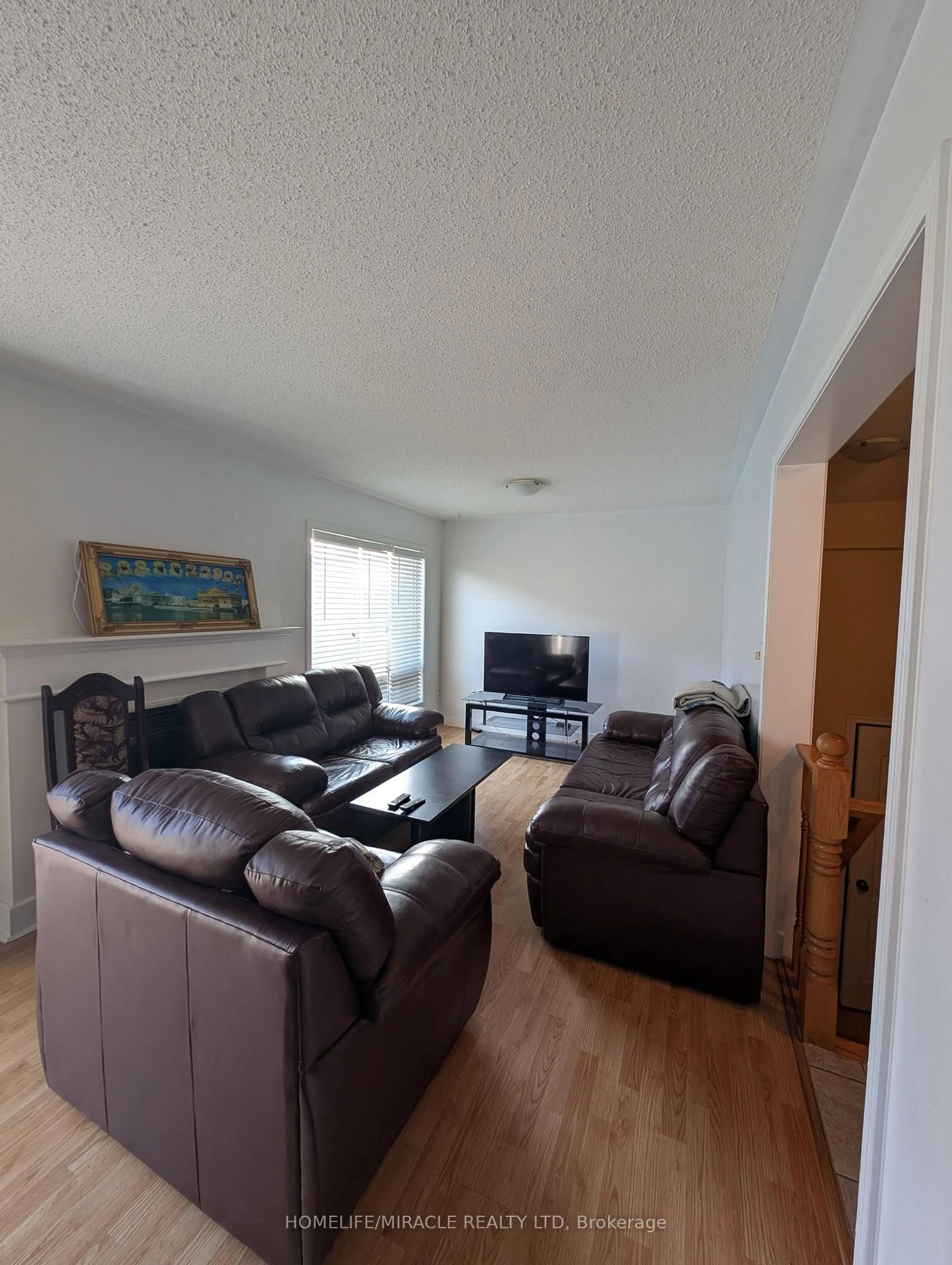 Living room with furniture, wood/laminate floor for 3115 Edgar Ave, Burlington Ontario L7M 0A6