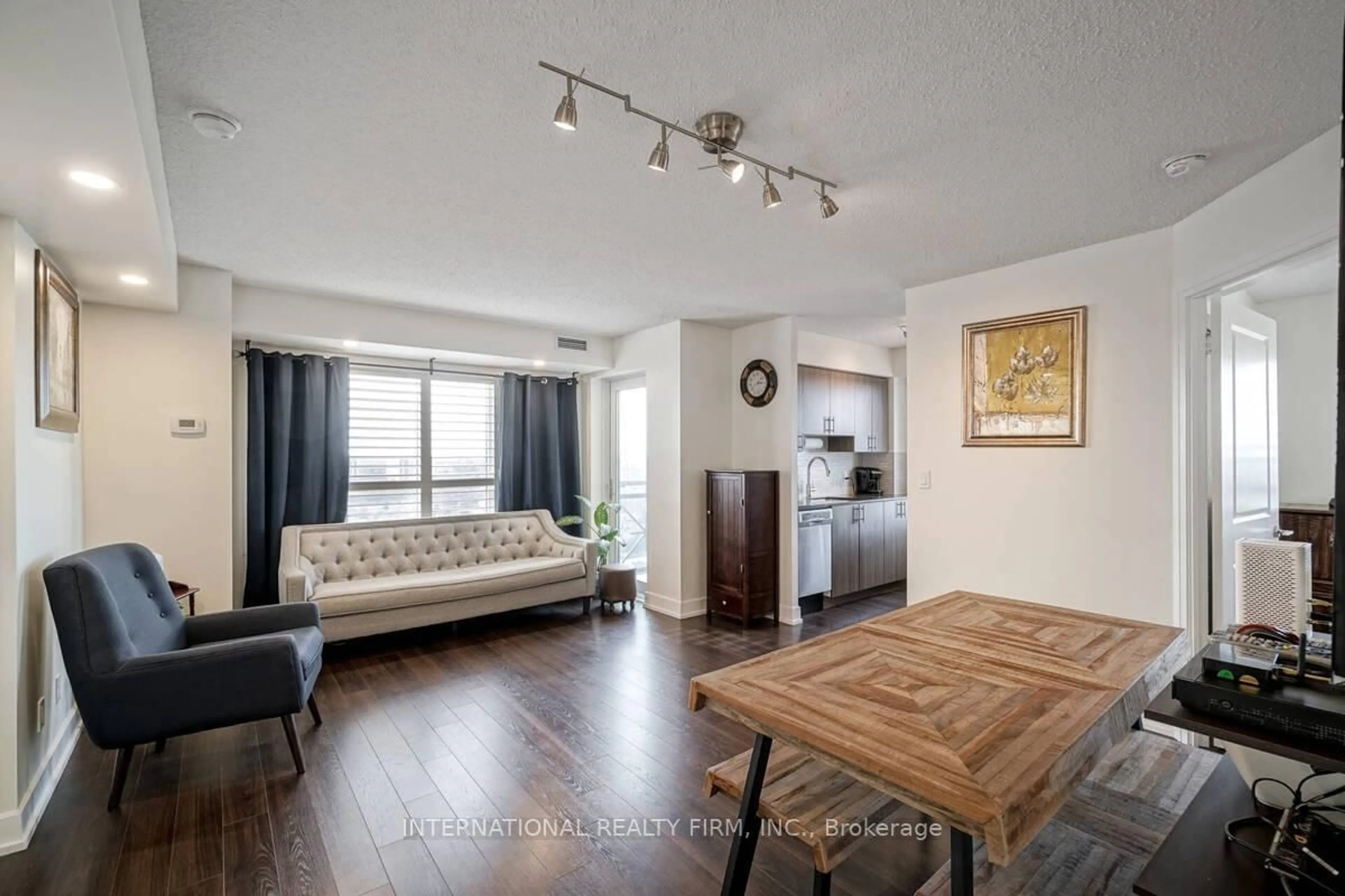 Living room with furniture, wood/laminate floor for 2 Eva Rd #2222, Toronto Ontario M9C 0A9