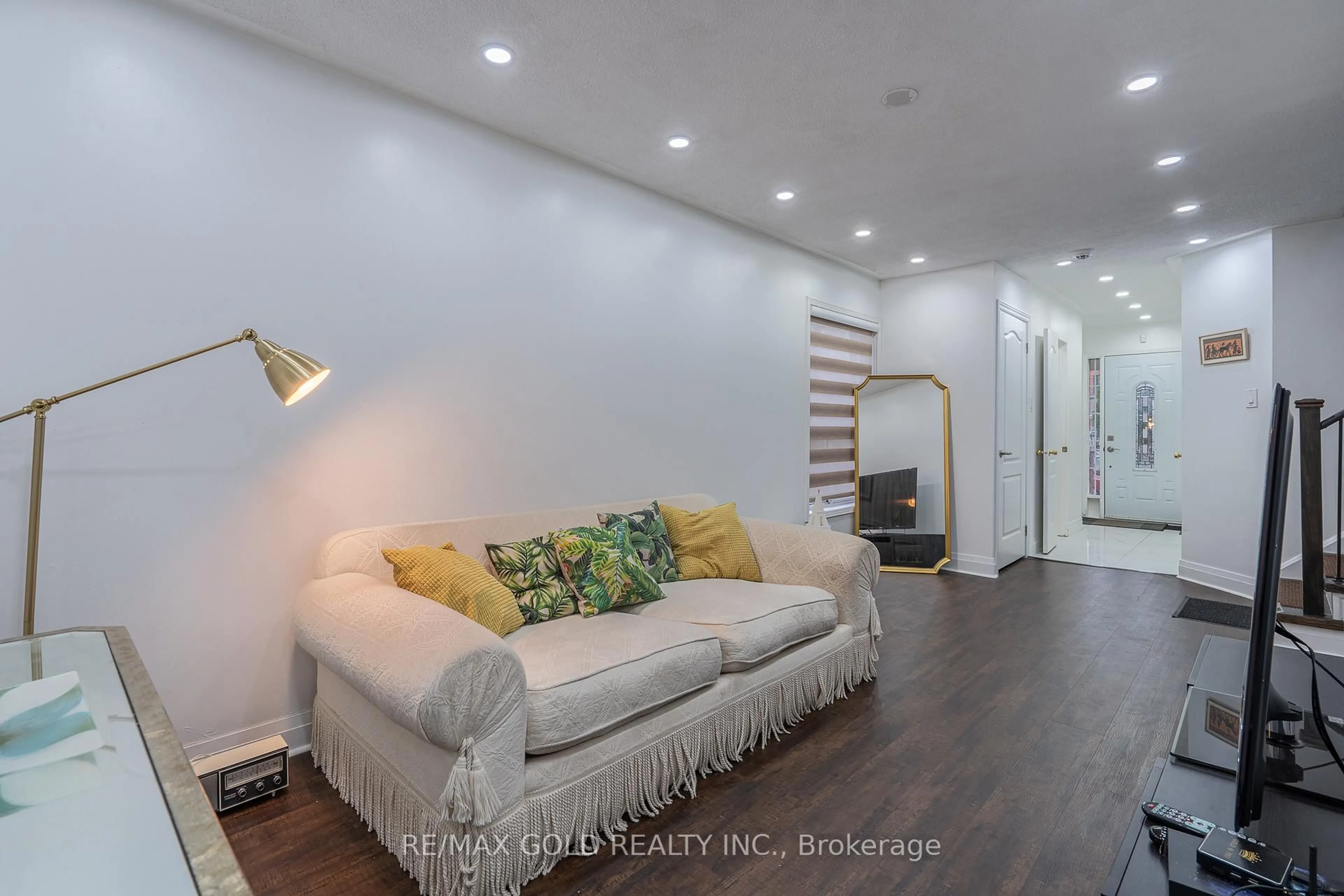 Living room with furniture, wood/laminate floor for 102 Bunchberry Way, Brampton Ontario L6R 2E8