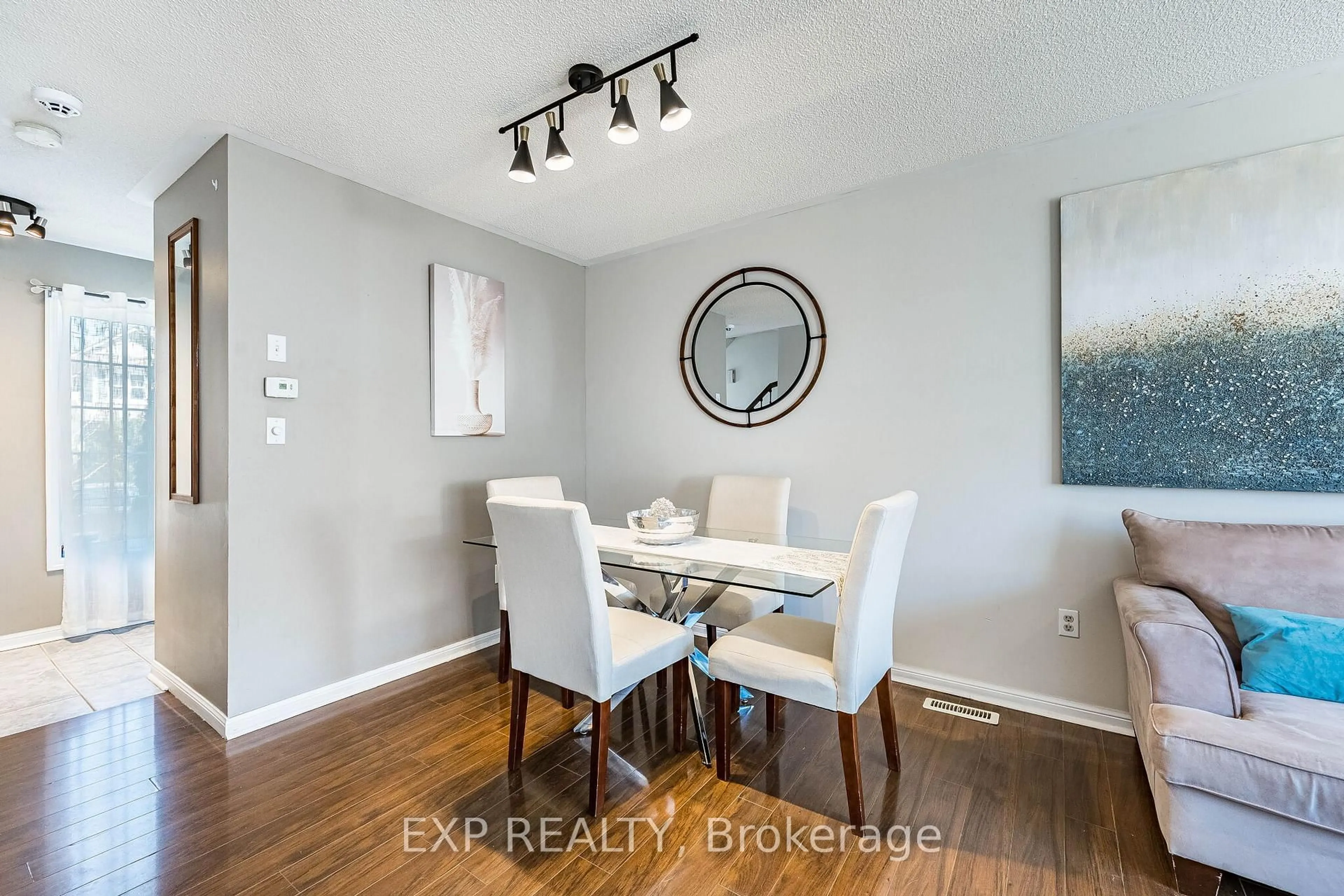 Dining room, wood/laminate floor for 53 Sweetwood Circ, Brampton Ontario L7A 2X7