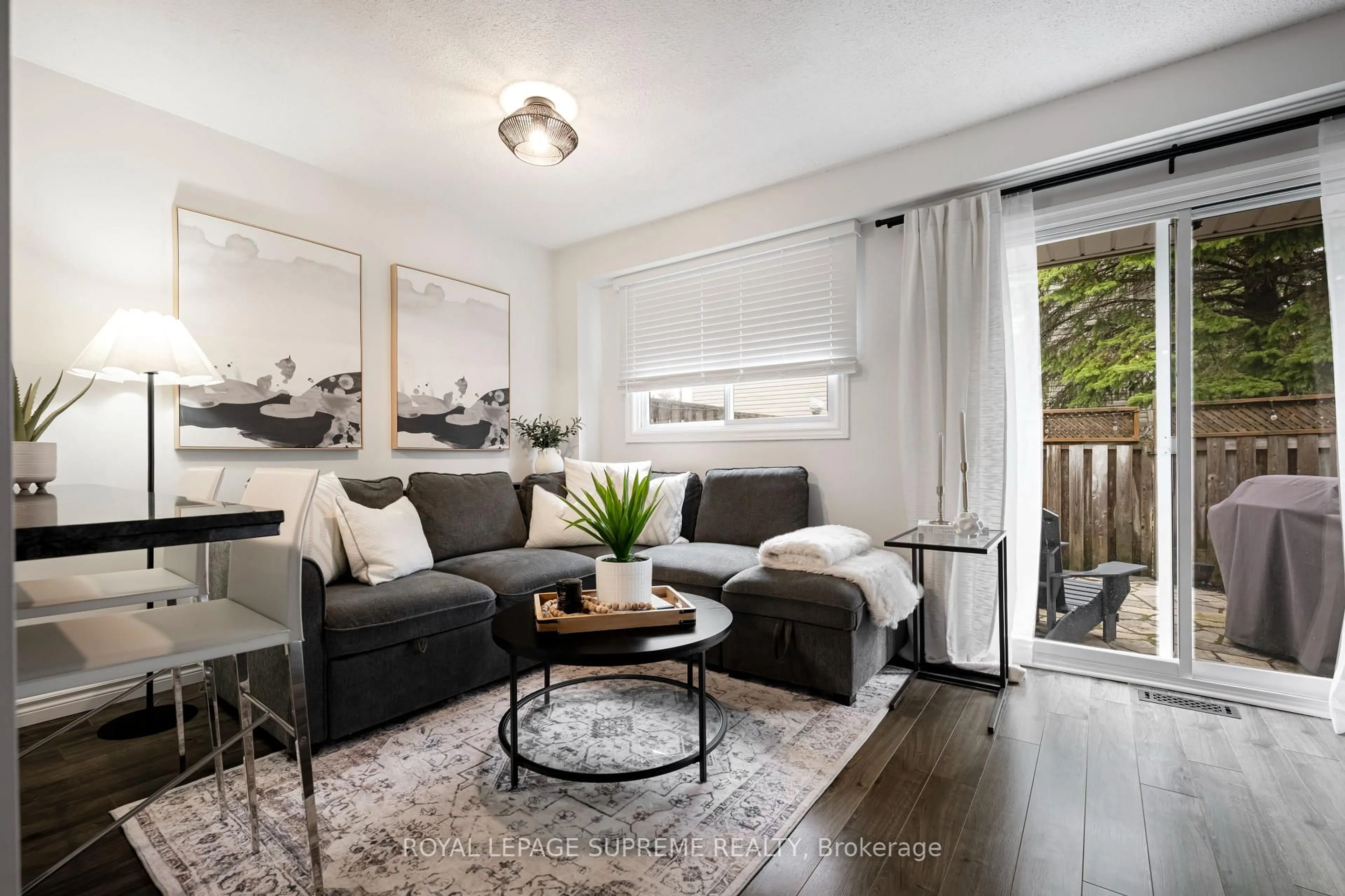 Living room with furniture, wood/laminate floor for 31 Orange Mill Crt #31, Orangeville Ontario L9W 3R6