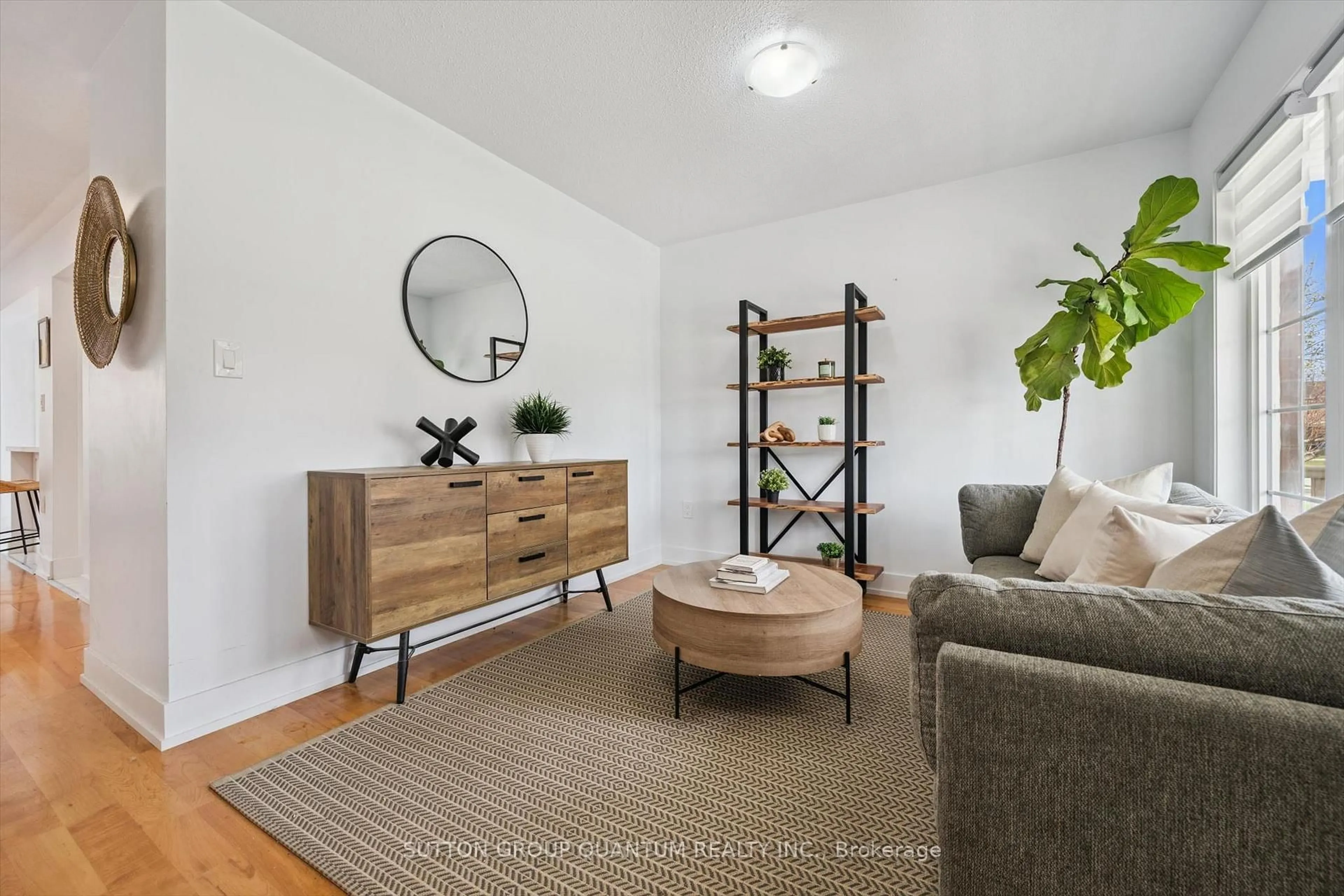 Living room with furniture, wood/laminate floor for 710 Irving Terr, Milton Ontario L9T 6H3