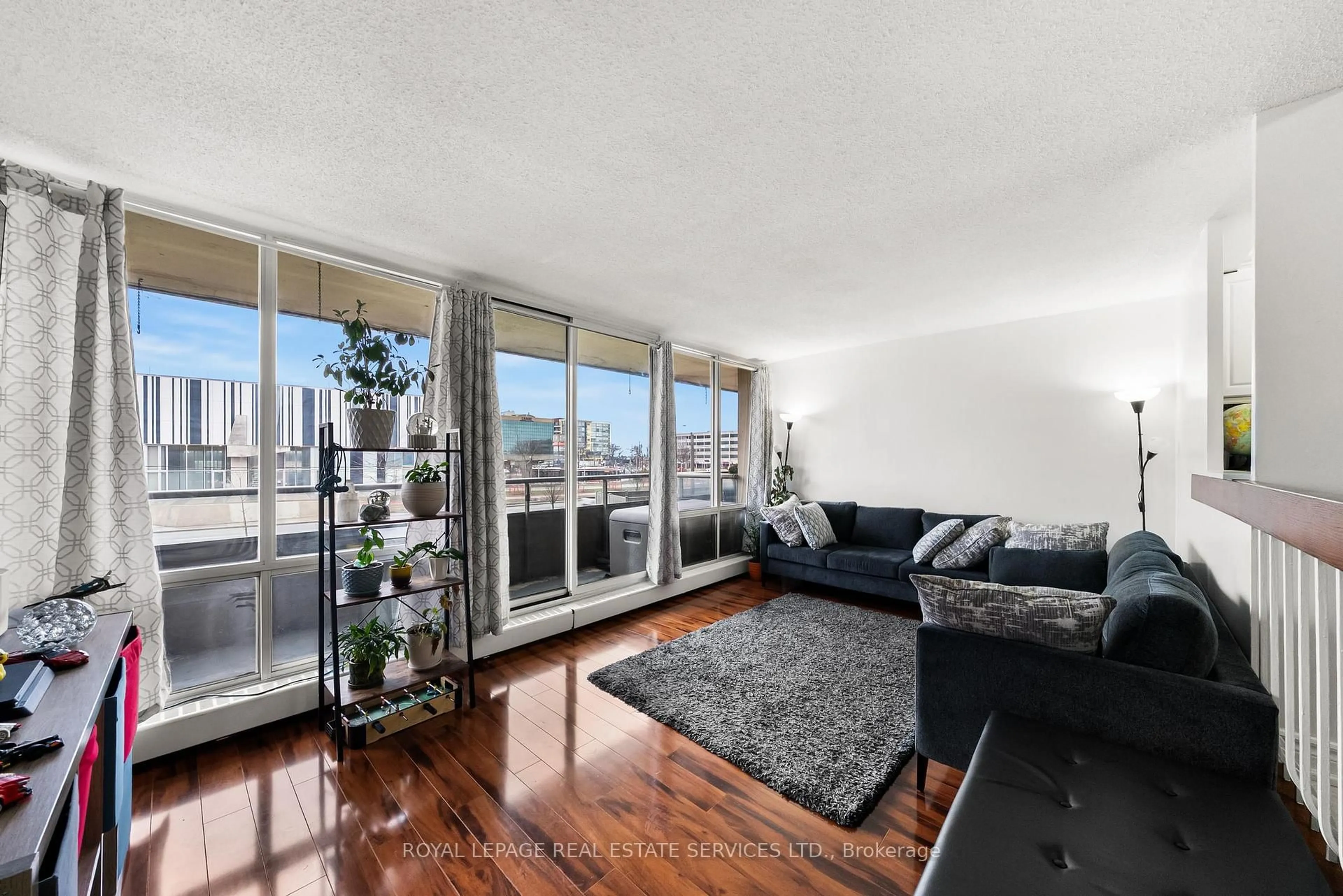 Living room with furniture, unknown for 1 Four Winds Dr #211, Toronto Ontario M3J 2T1