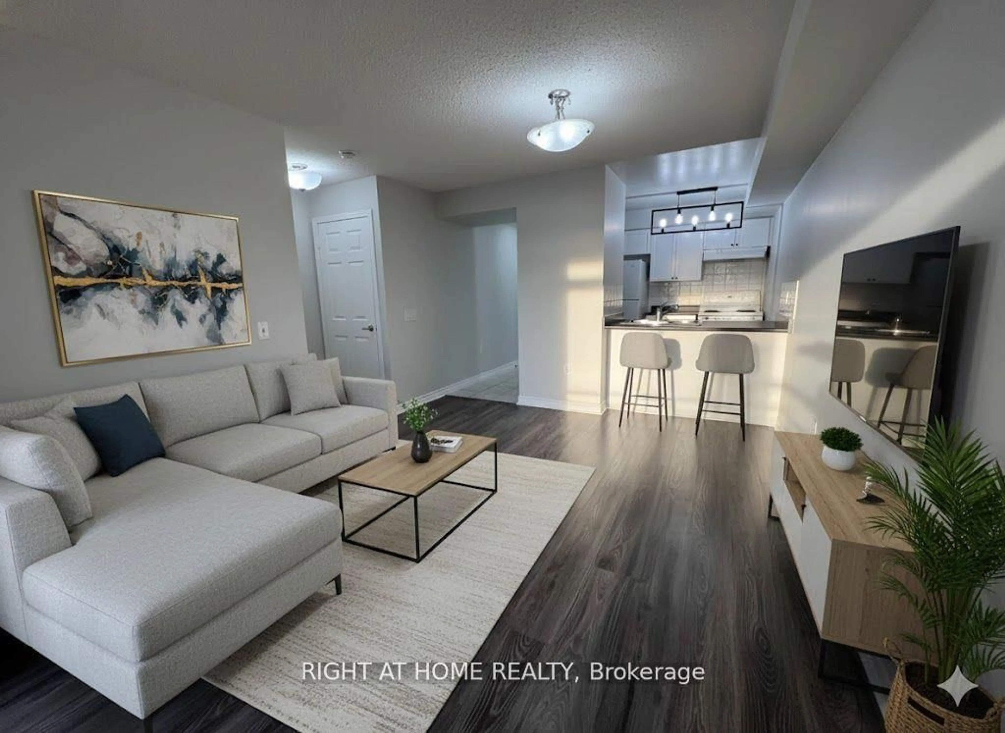 Living room with furniture, wood/laminate floor for 55 Strathaven Dr #1808, Mississauga Ontario L5R 4G9