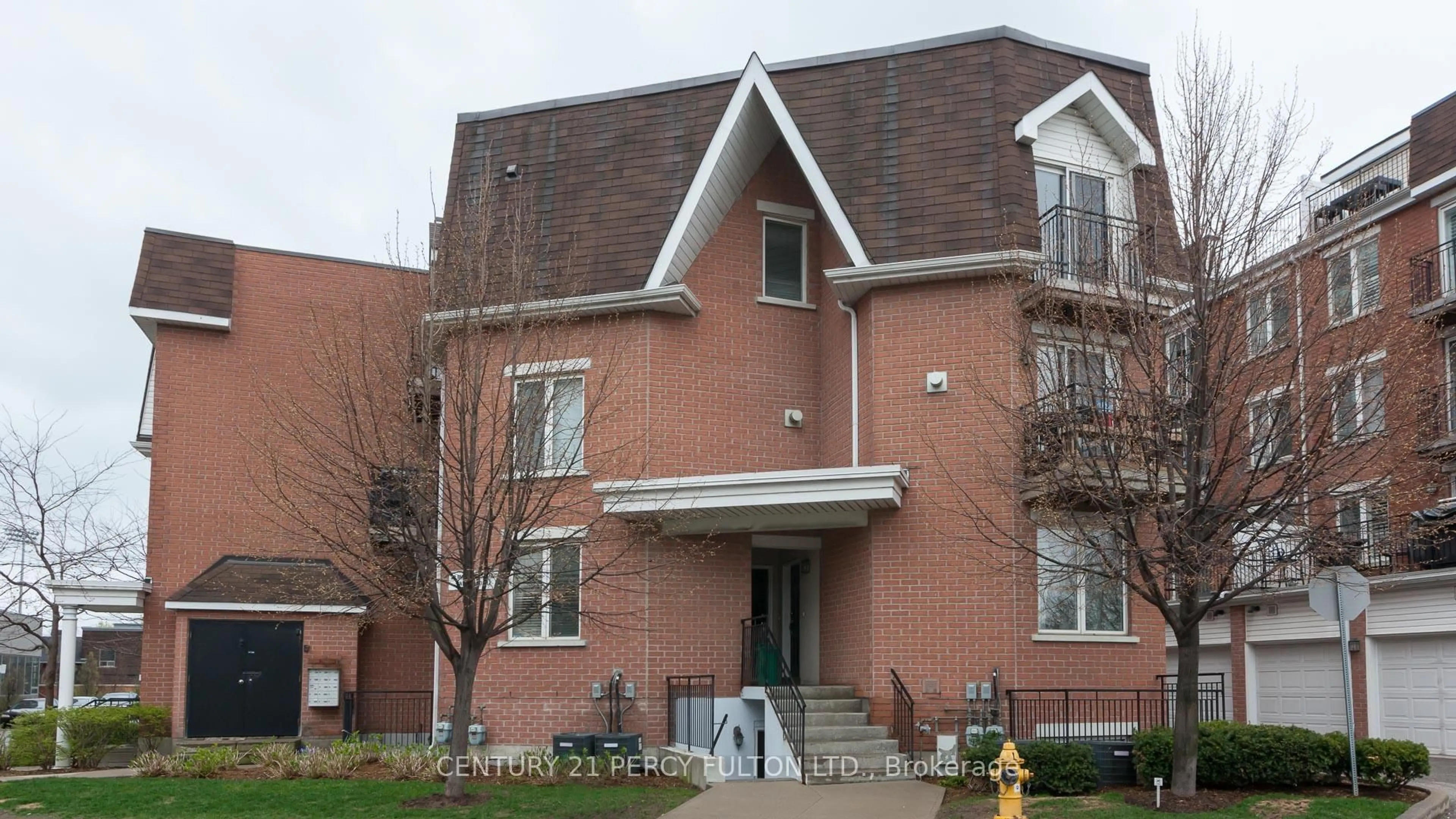 Home with brick exterior material, street for 20 Machells Ave #112, Toronto Ontario M6K 3H8