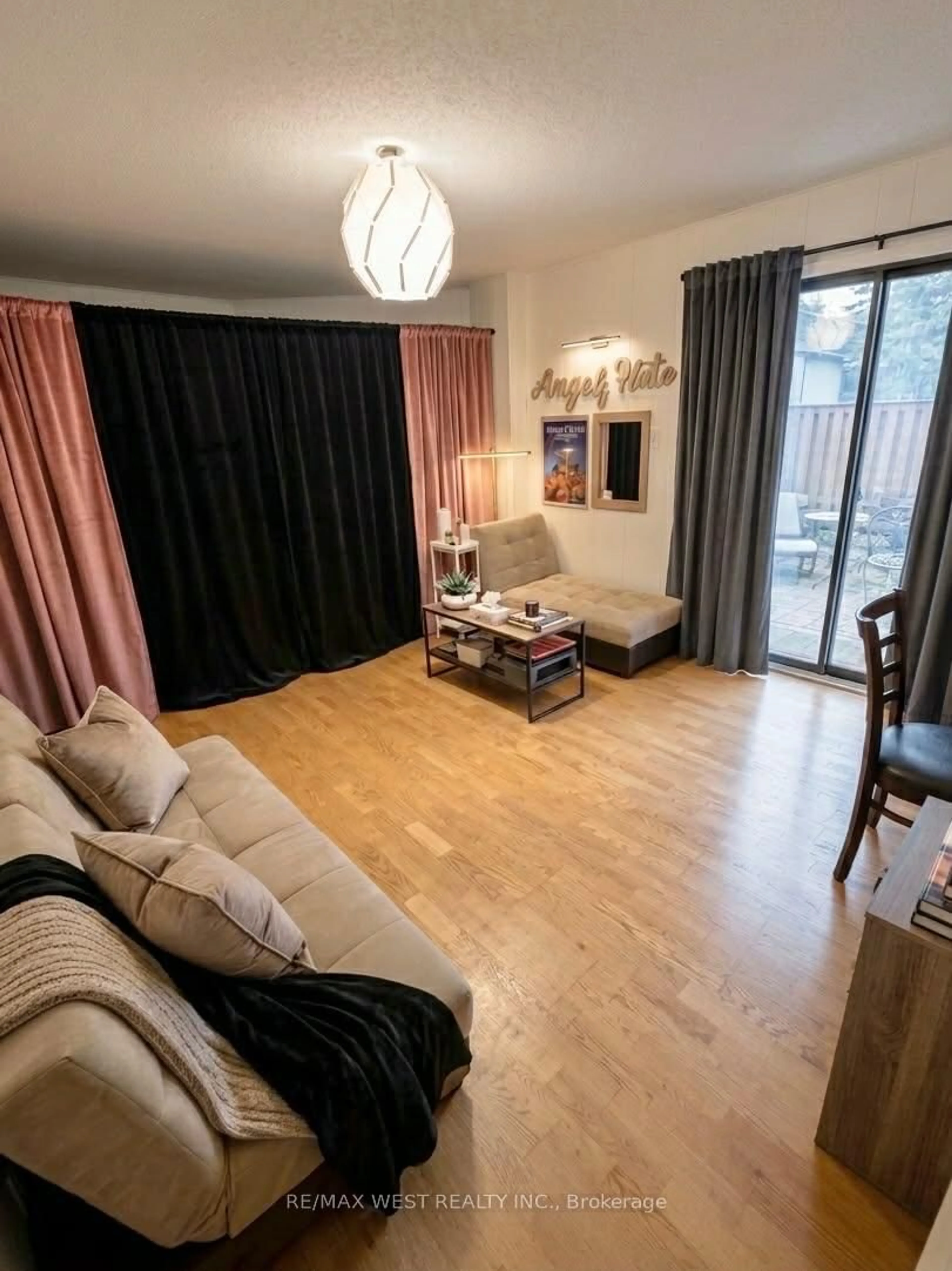 Living room with furniture, wood/laminate floor for 69 Maple Branch Path #37, Toronto Ontario M9P 3T4