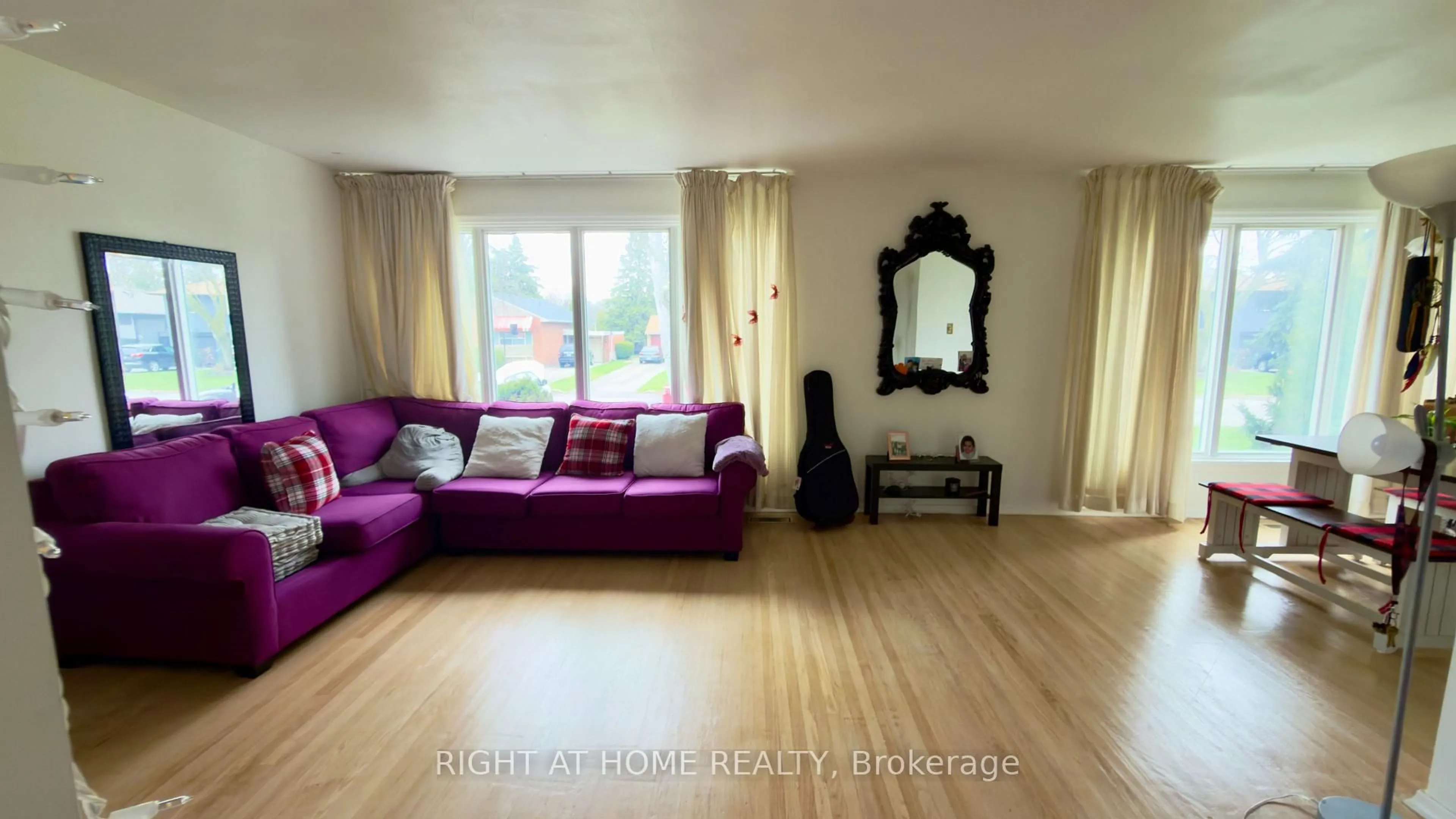 Living room with furniture, wood/laminate floor for 21 Mitre Pl, Toronto Ontario M9R 3C5