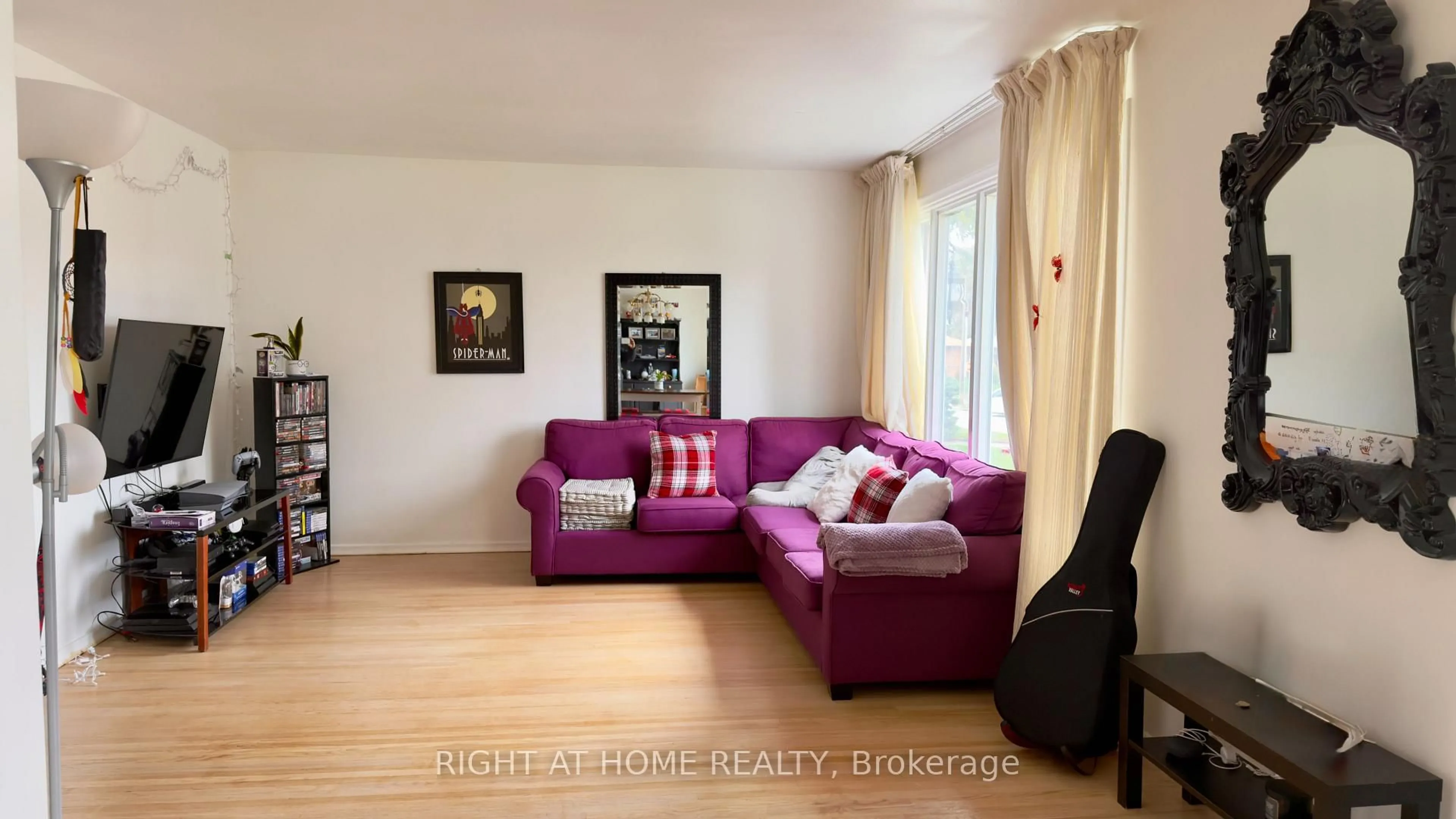 Living room with furniture, wood/laminate floor for 21 Mitre Pl, Toronto Ontario M9R 3C5