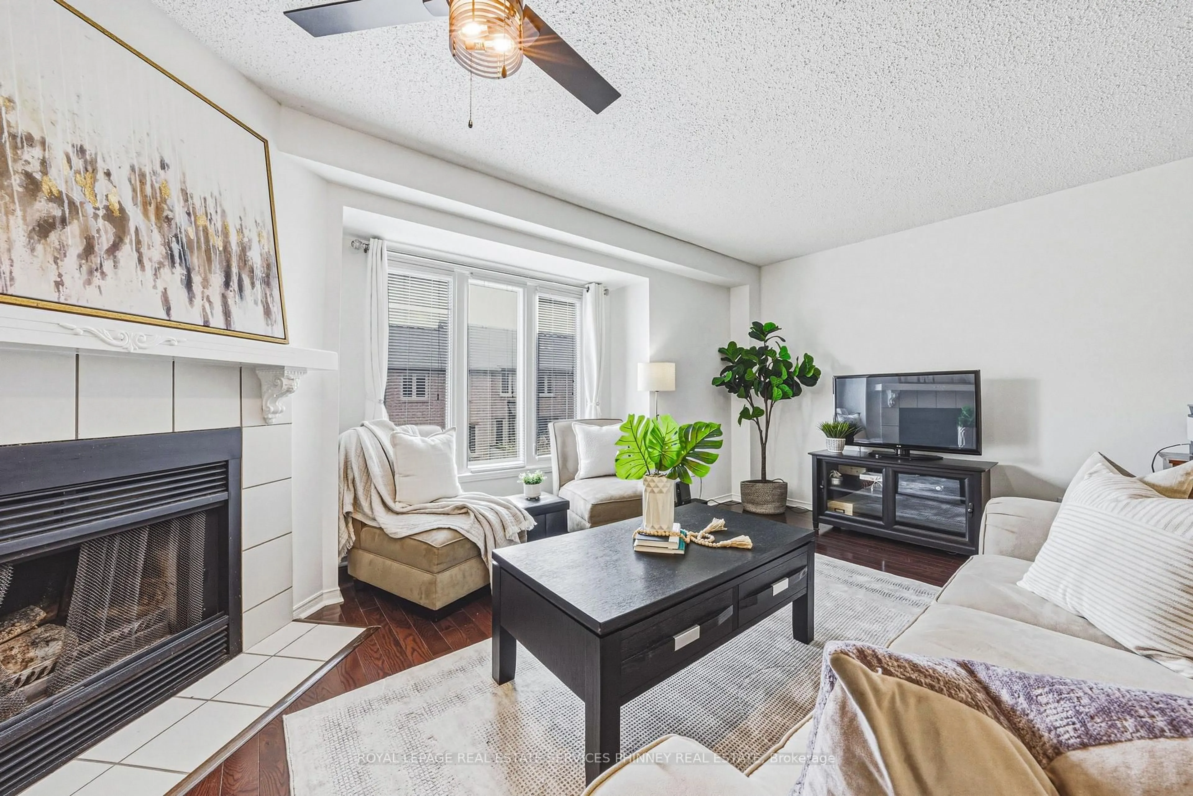 Living room with furniture, wood/laminate floor for 3140 Fifth Line #28, Mississauga Ontario L5L 1A2