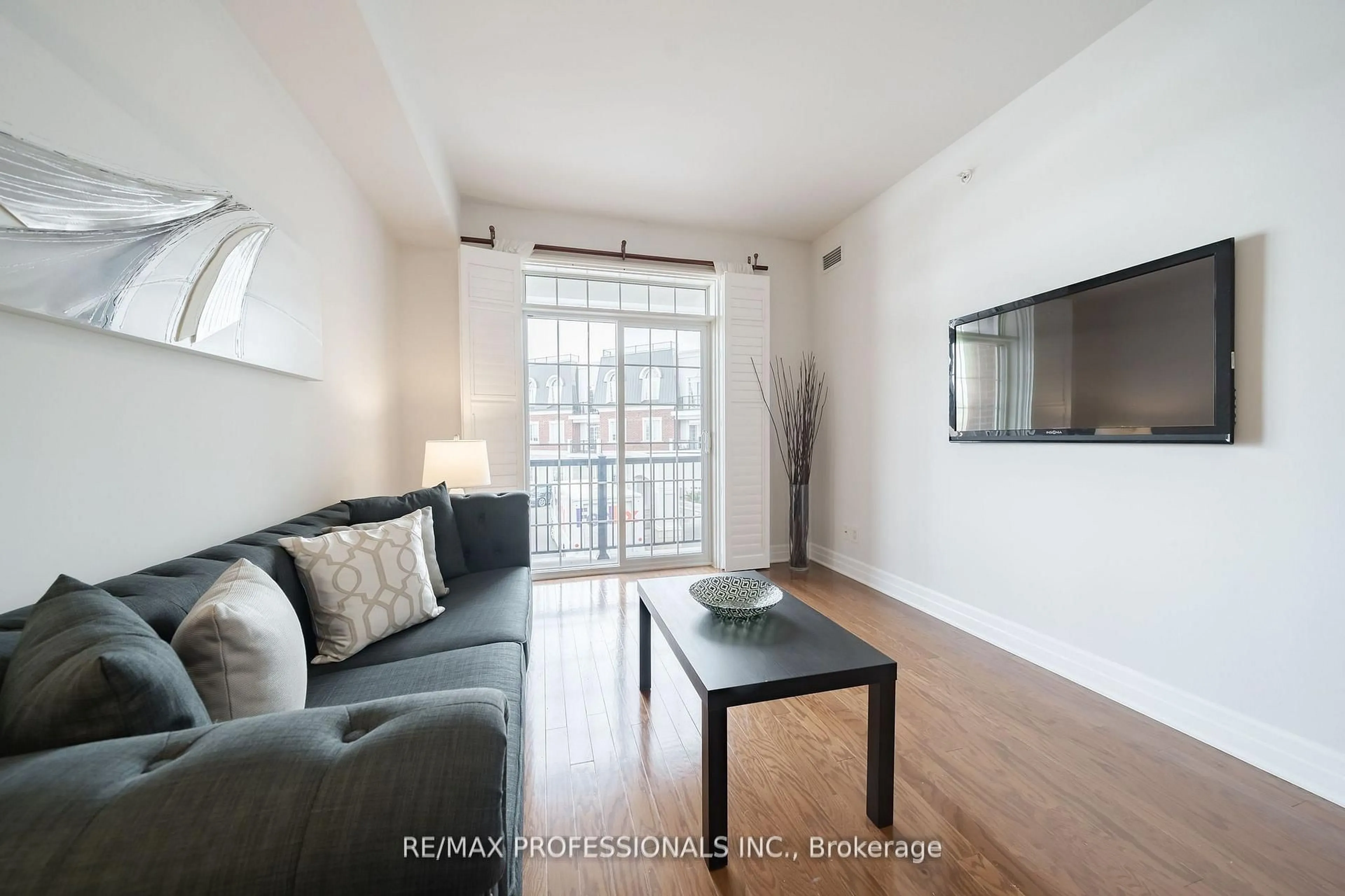 Living room with furniture, wood/laminate floor for 2300 Upper Middle Rd #228, Oakville Ontario L6M 0T4