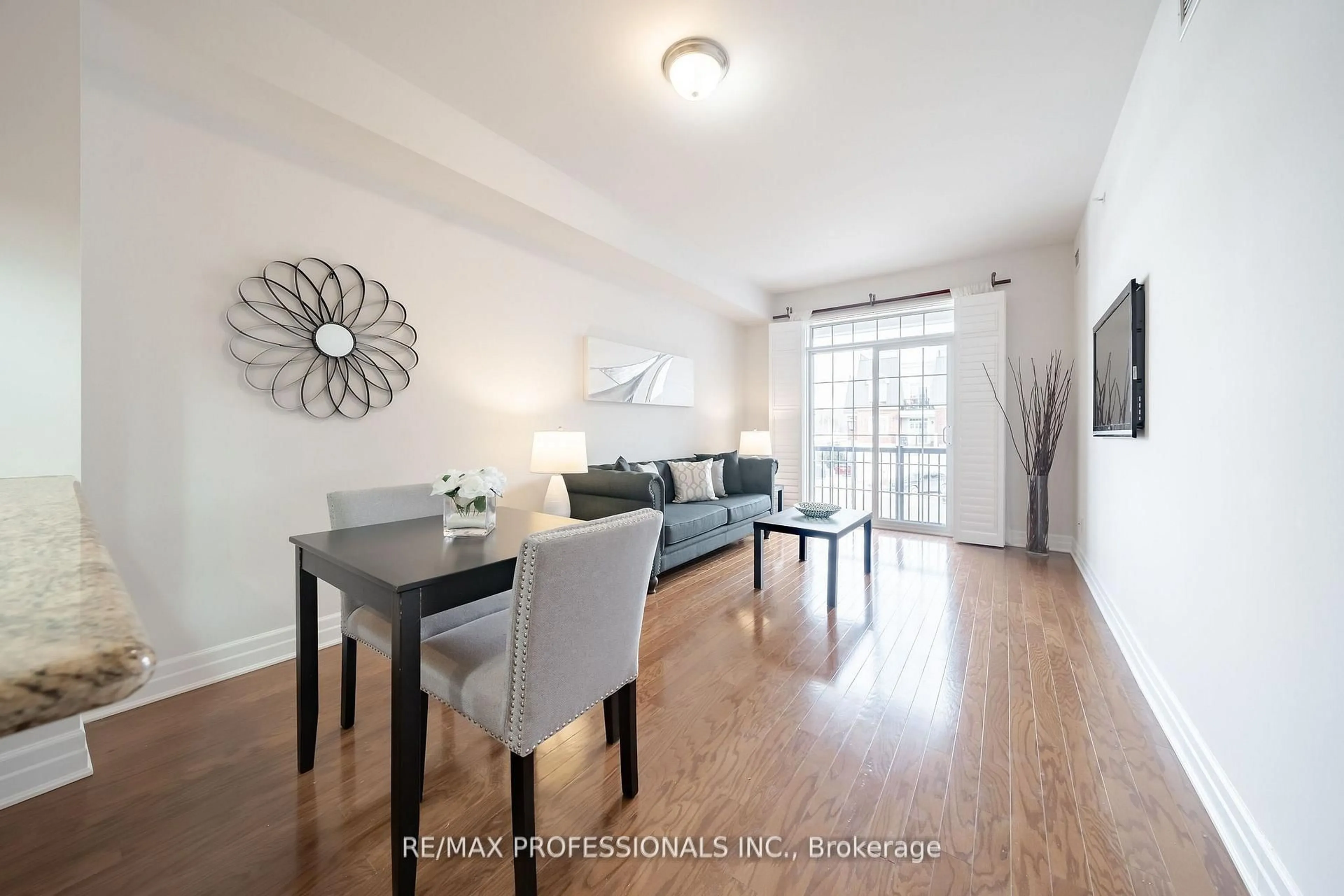 Living room with furniture, wood/laminate floor for 2300 Upper Middle Rd #228, Oakville Ontario L6M 0T4