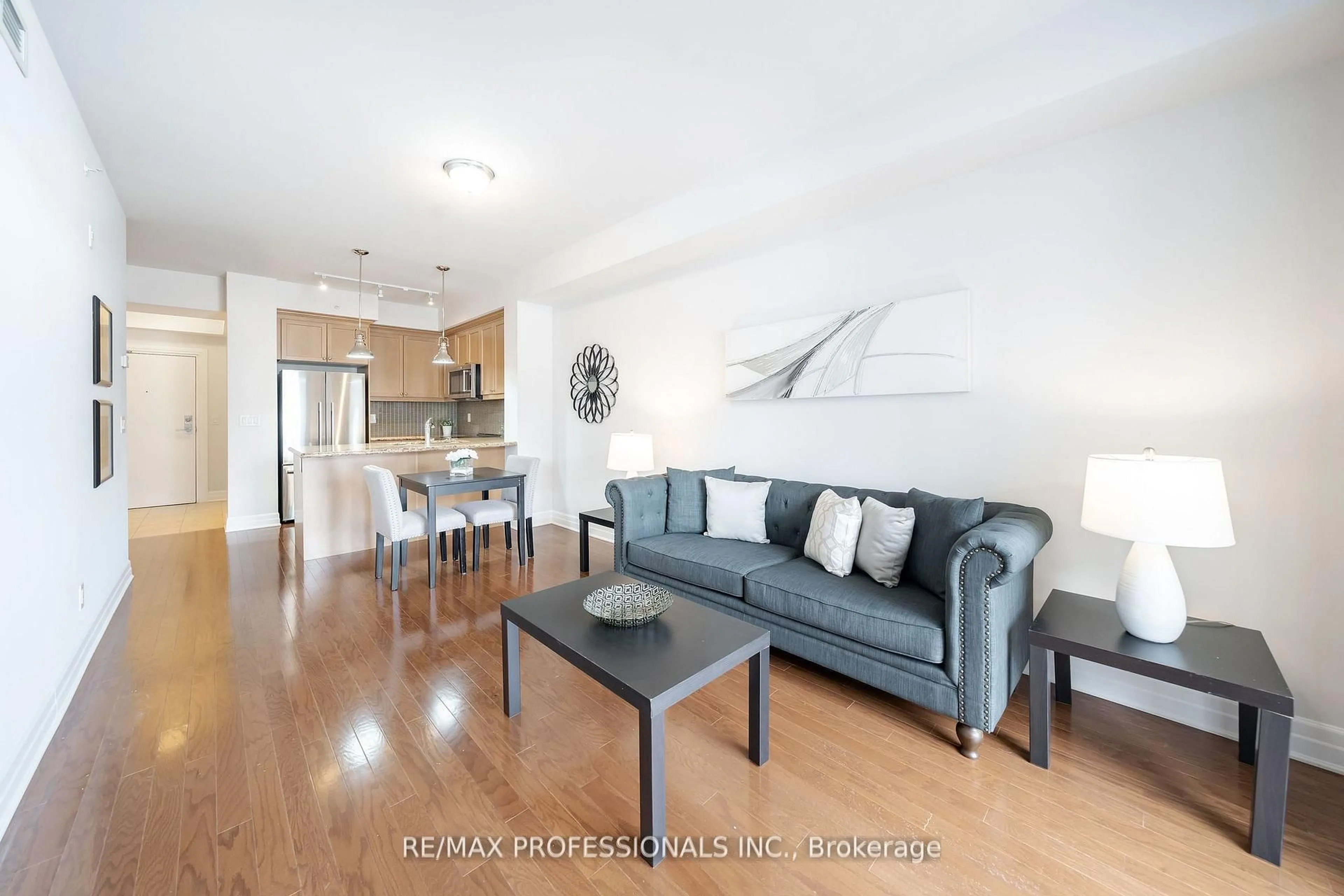 Living room with furniture, wood/laminate floor for 2300 Upper Middle Rd #228, Oakville Ontario L6M 0T4