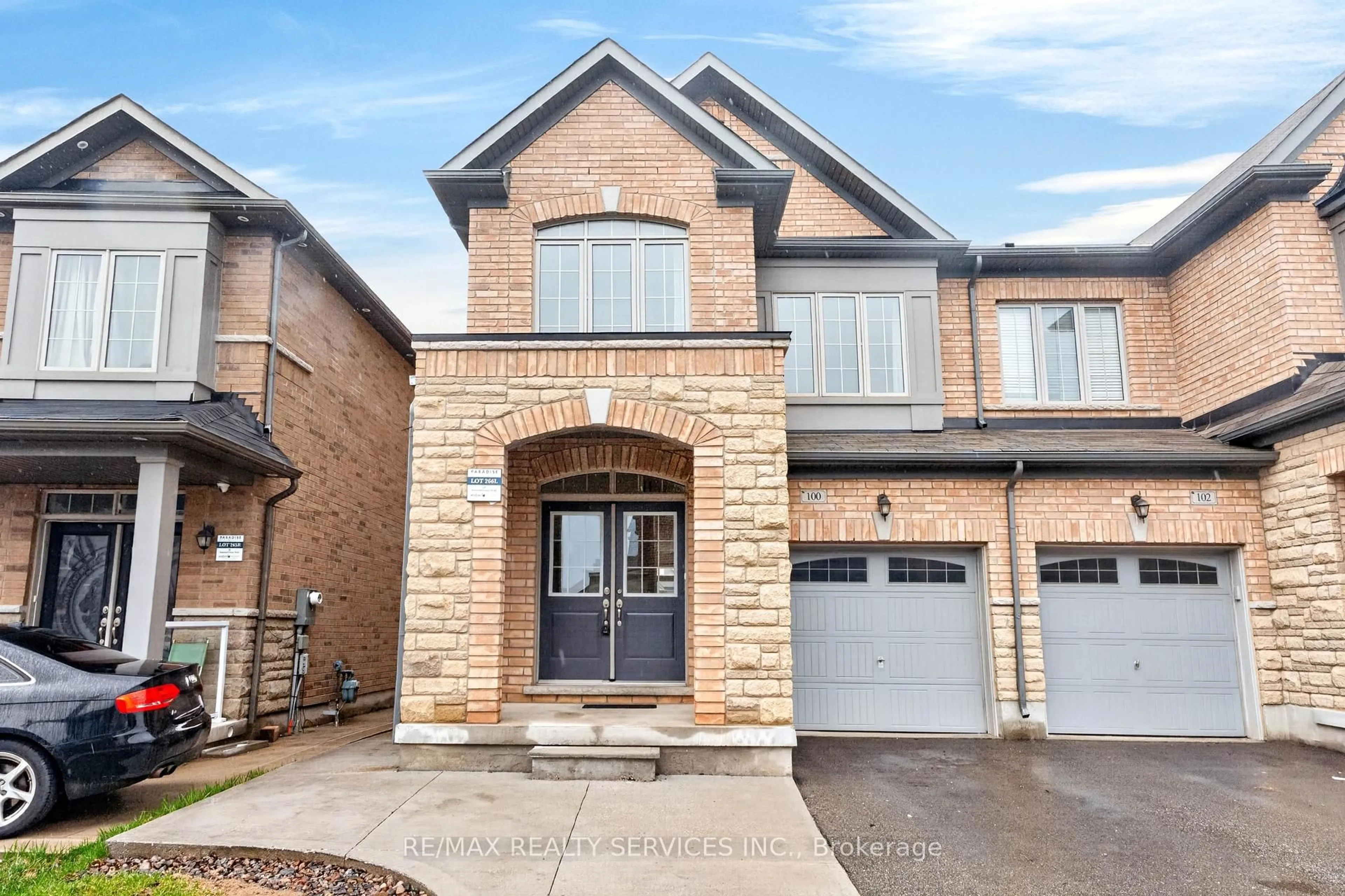 Home with brick exterior material, street for 100 Emerald Coast Tr, Brampton Ontario L7A 5A7