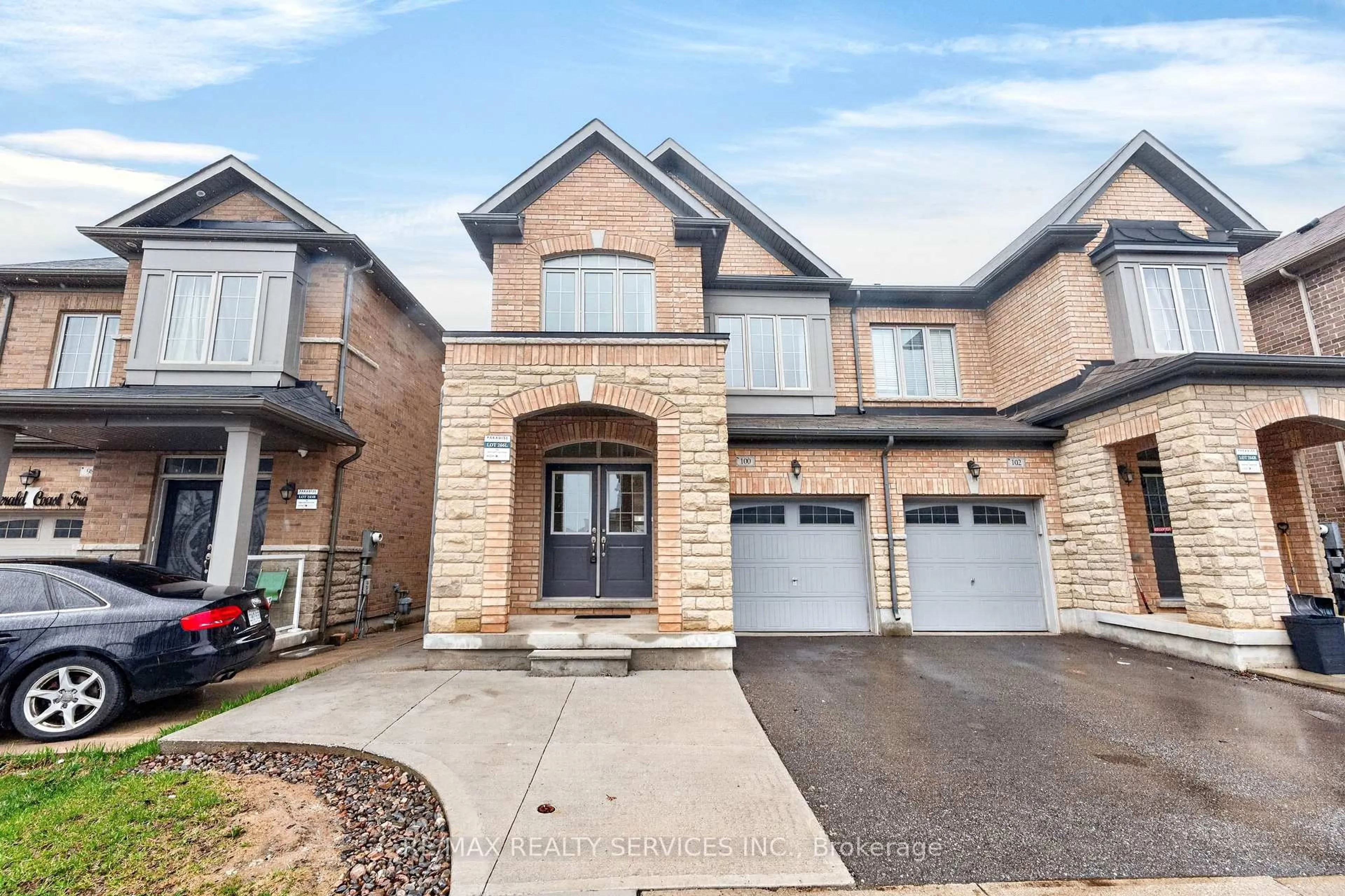 Home with brick exterior material, street for 100 Emerald Coast Tr, Brampton Ontario L7A 5A7