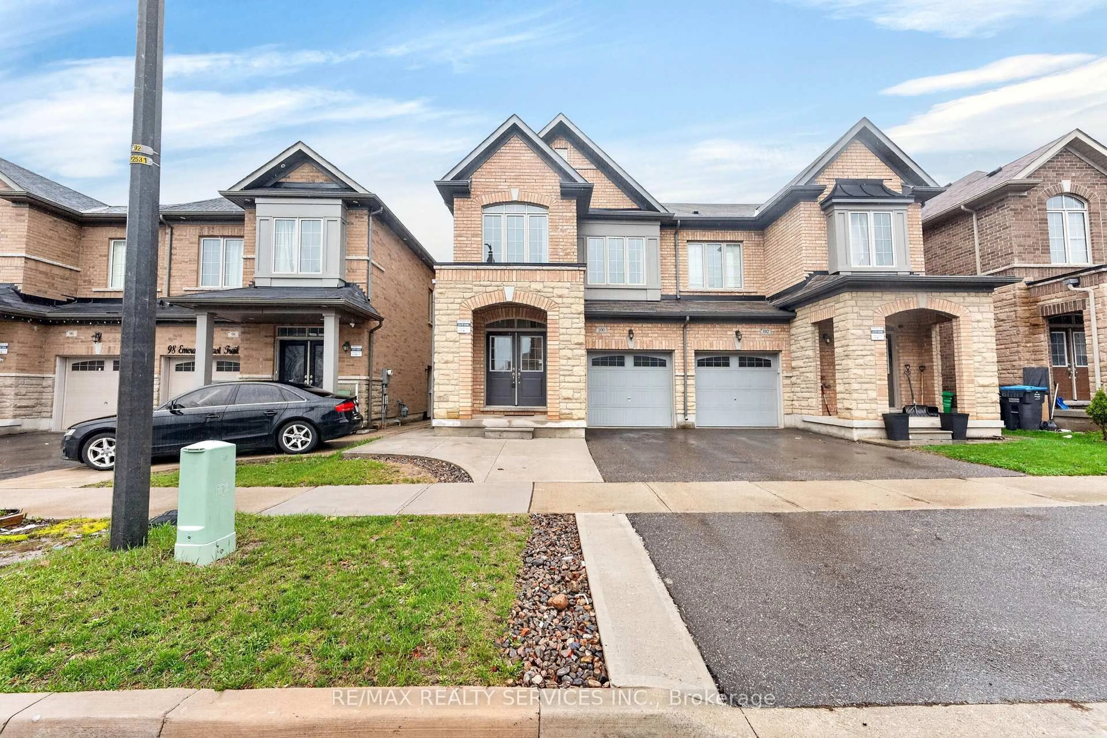 Home with brick exterior material, street for 100 Emerald Coast Tr, Brampton Ontario L7A 5A7