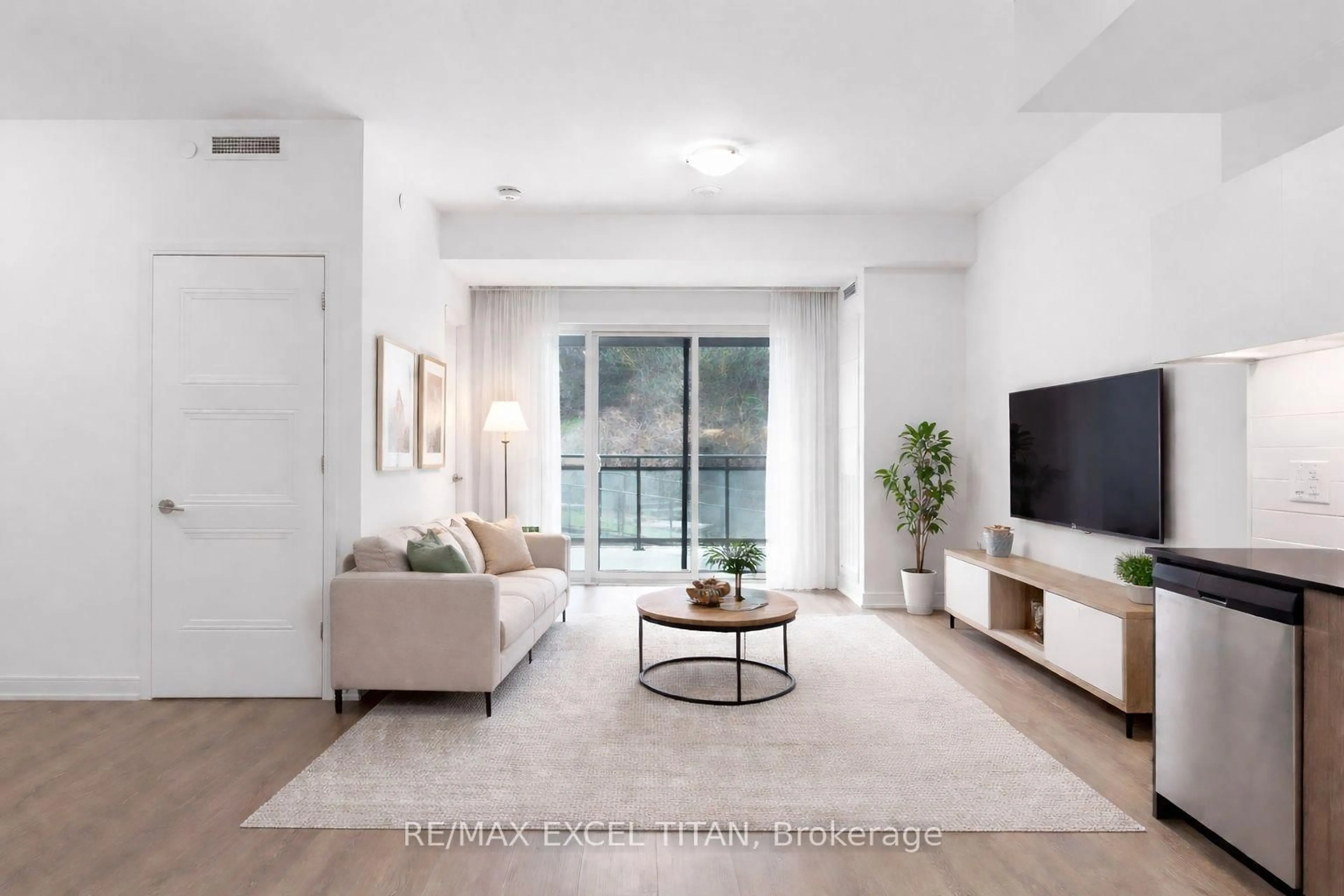 Living room with furniture, unknown for 25 Neighbourhood Lane #205, Toronto Ontario M8Y 0C4