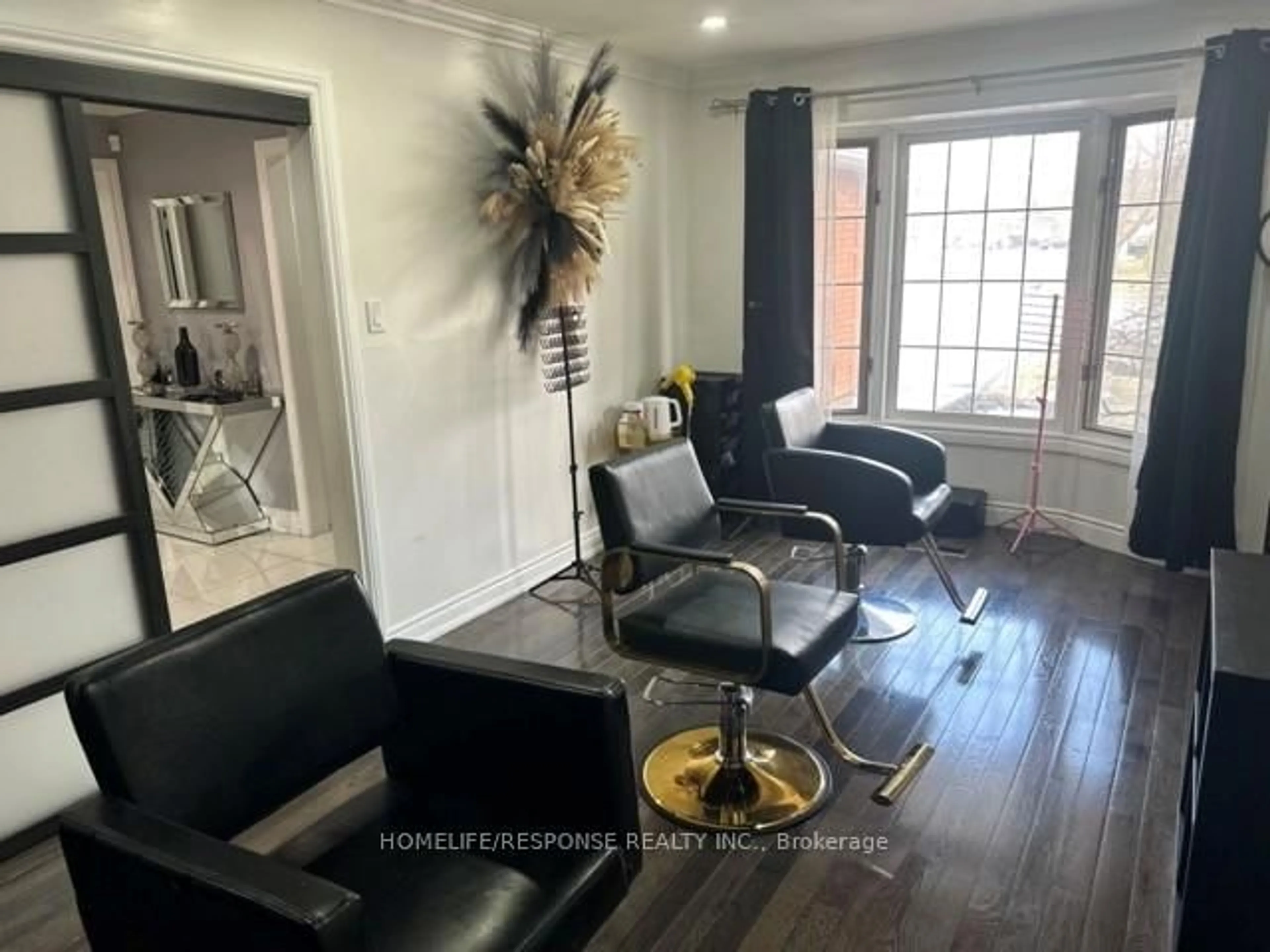 Living room with furniture, wood/laminate floor for 16 Cochrane Ave, Brampton Ontario L6Z 4J4