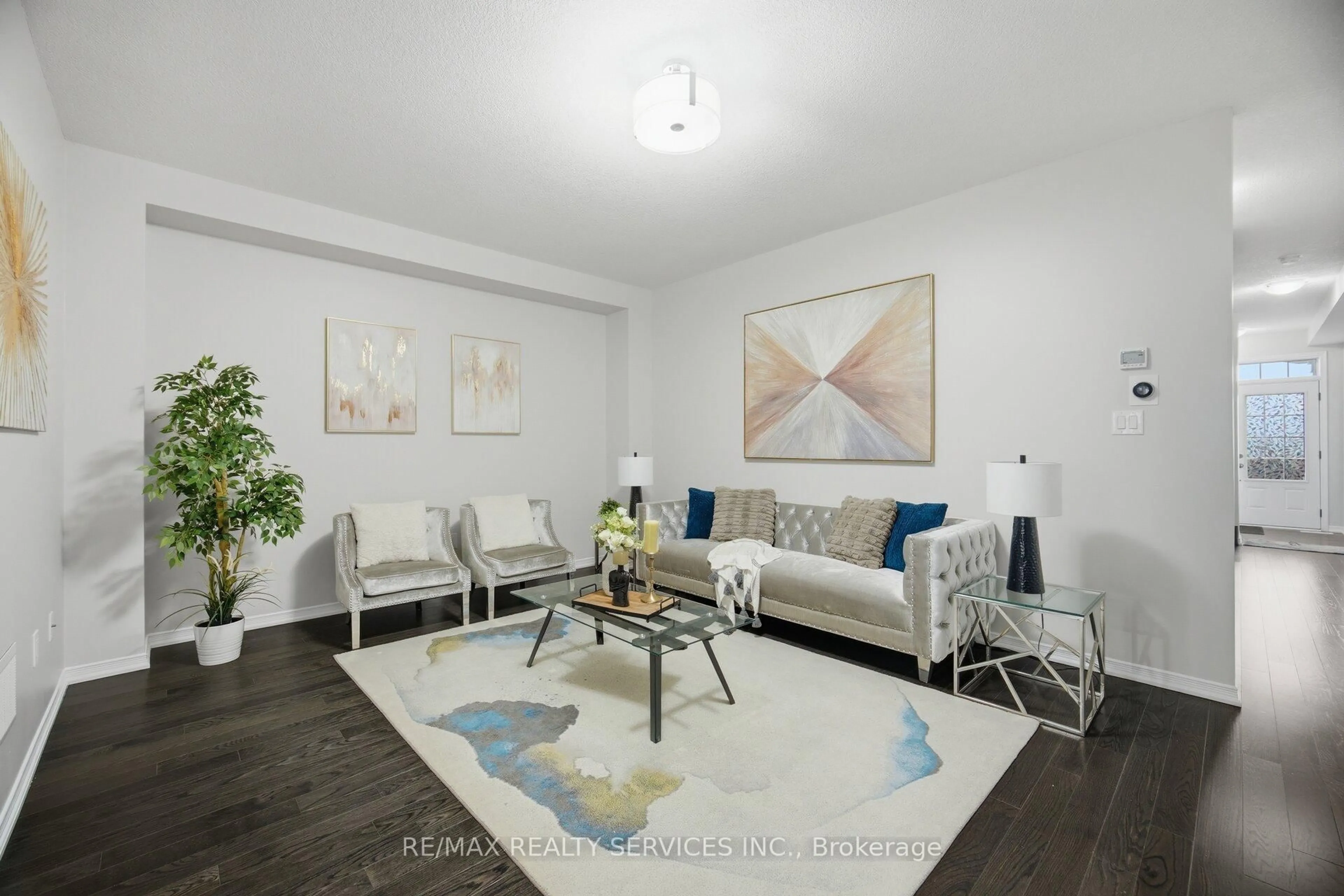 Living room with furniture, wood/laminate floor for 25 Baffin Cres, Brampton Ontario L7A 4K7