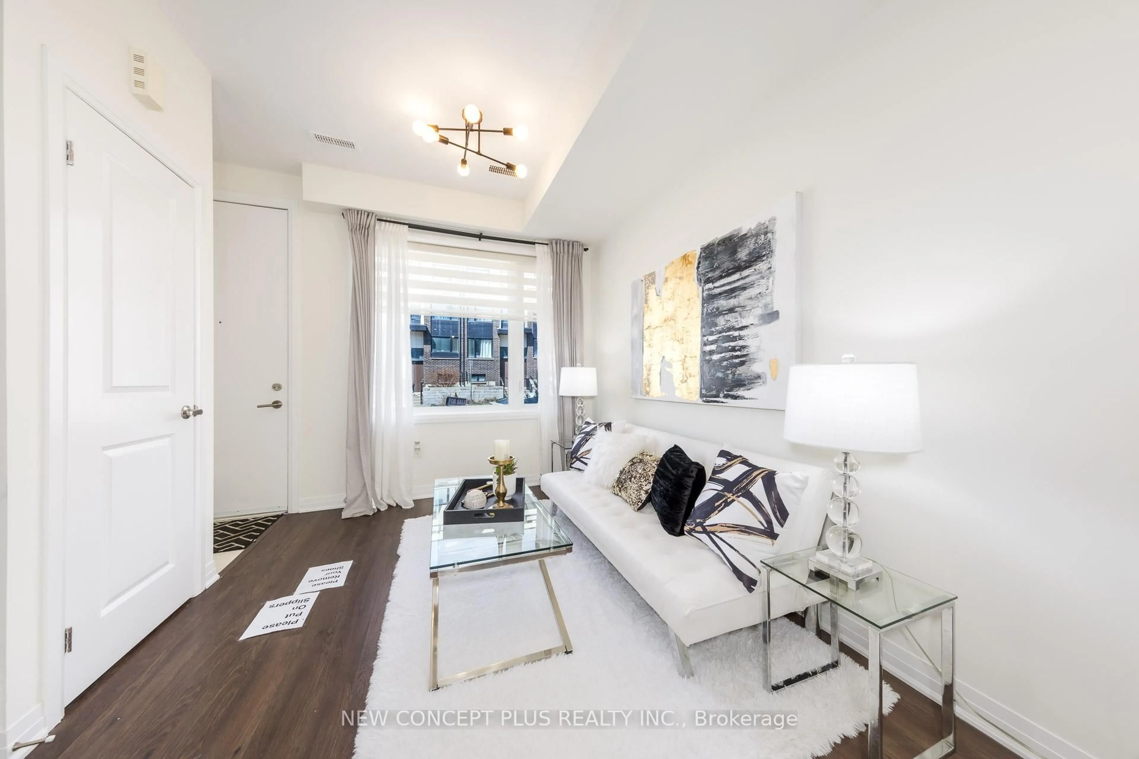 Living room with furniture, wood/laminate floor for 9 Thomas Mulholland Dr, Toronto Ontario M3K 0C1