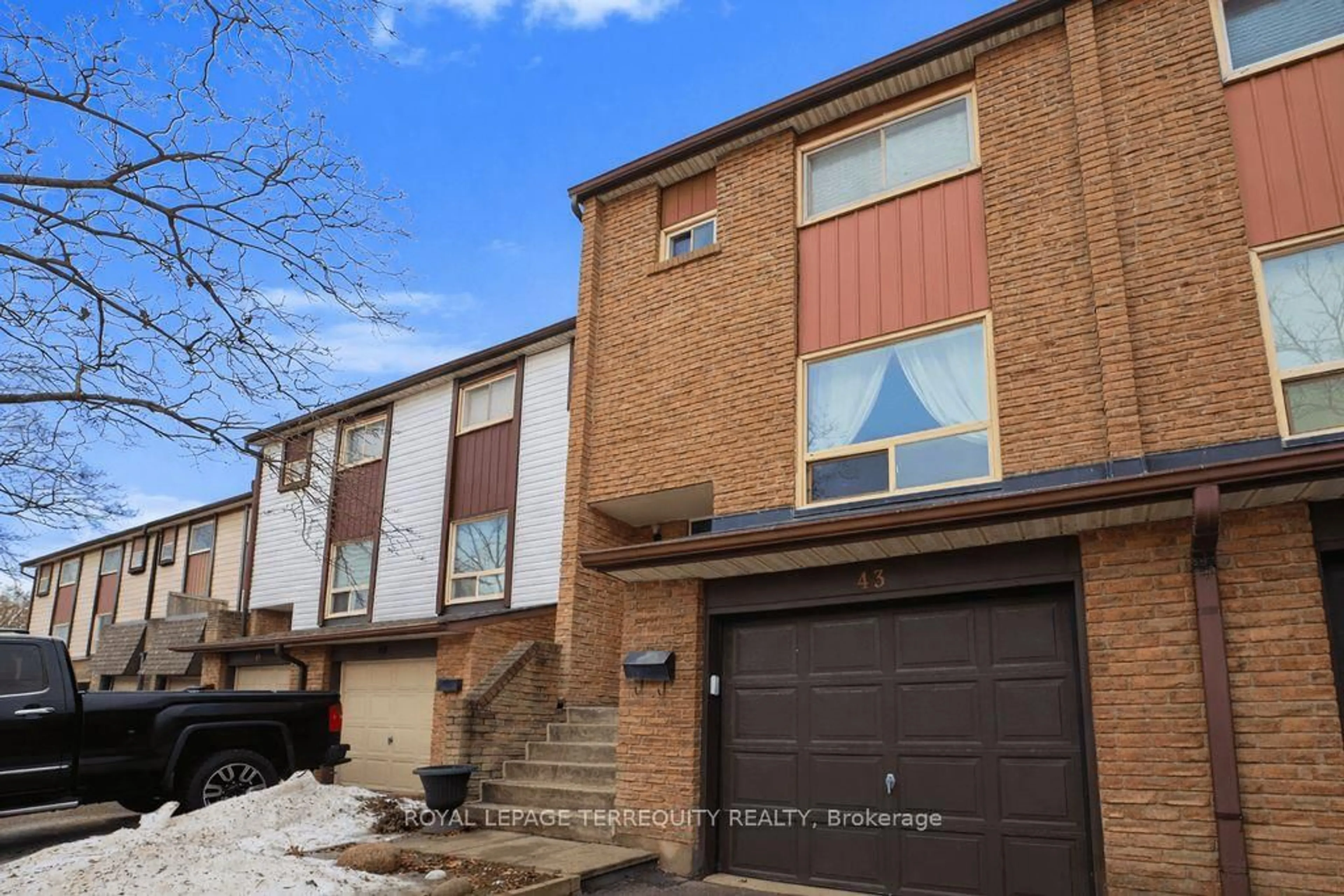 Home with brick exterior material, street for 1221 Dundix Rd #43, Mississauga Ontario L4Y 3Y9
