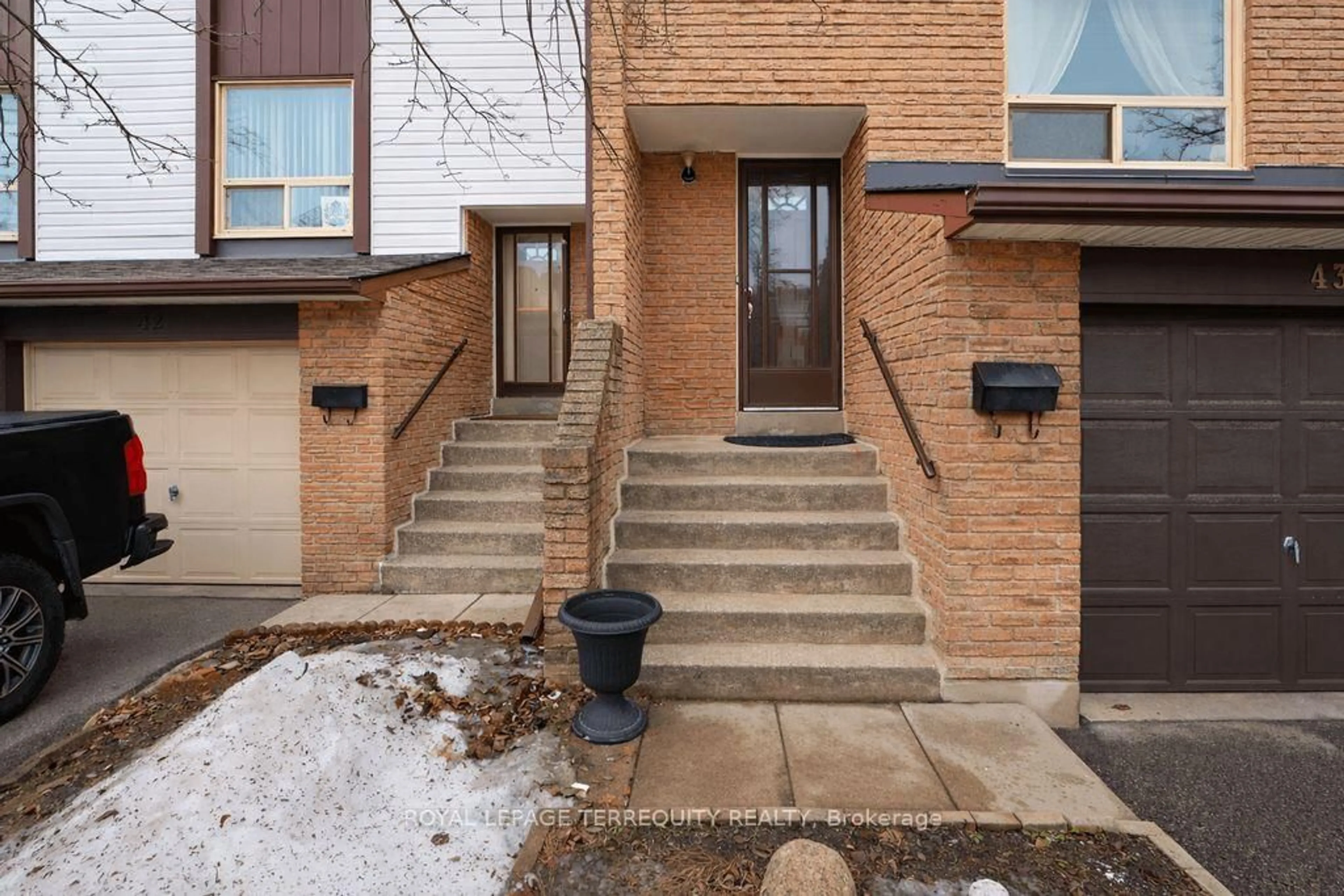 Home with brick exterior material, street for 1221 Dundix Rd #43, Mississauga Ontario L4Y 3Y9