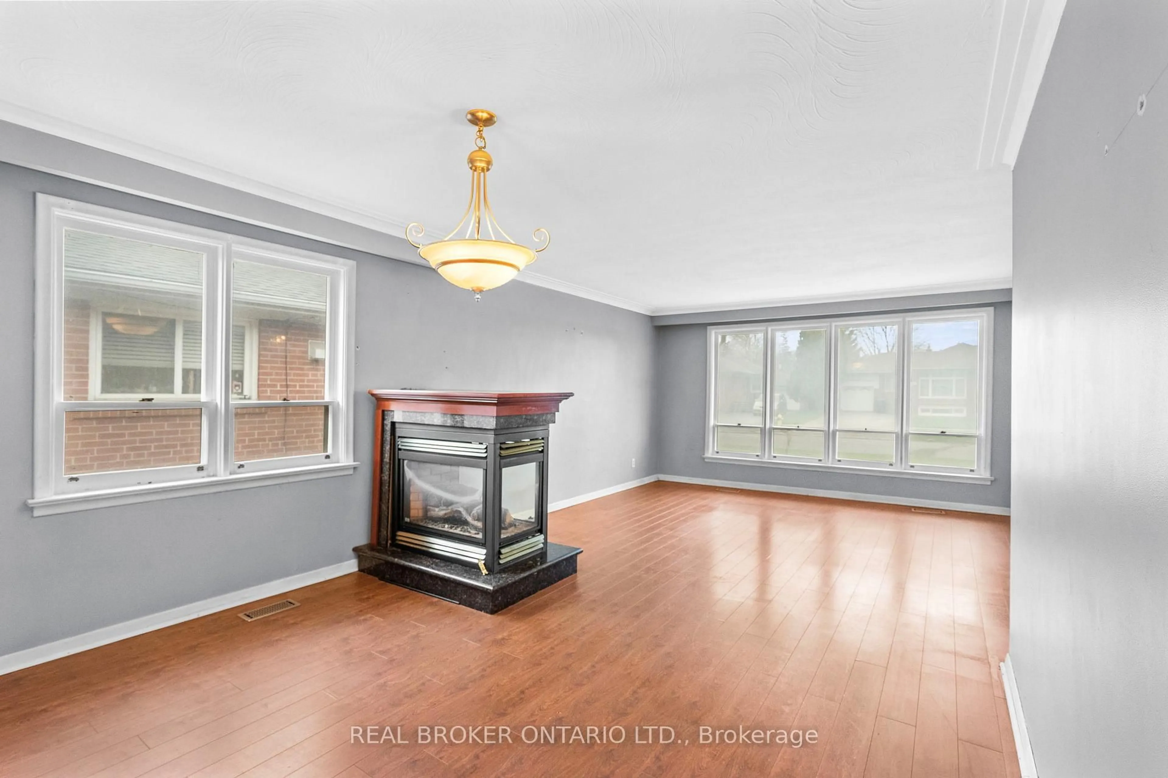 Living room with furniture, wood/laminate floor for 167 Jeffcoat Dr, Toronto Ontario M9W 3C4