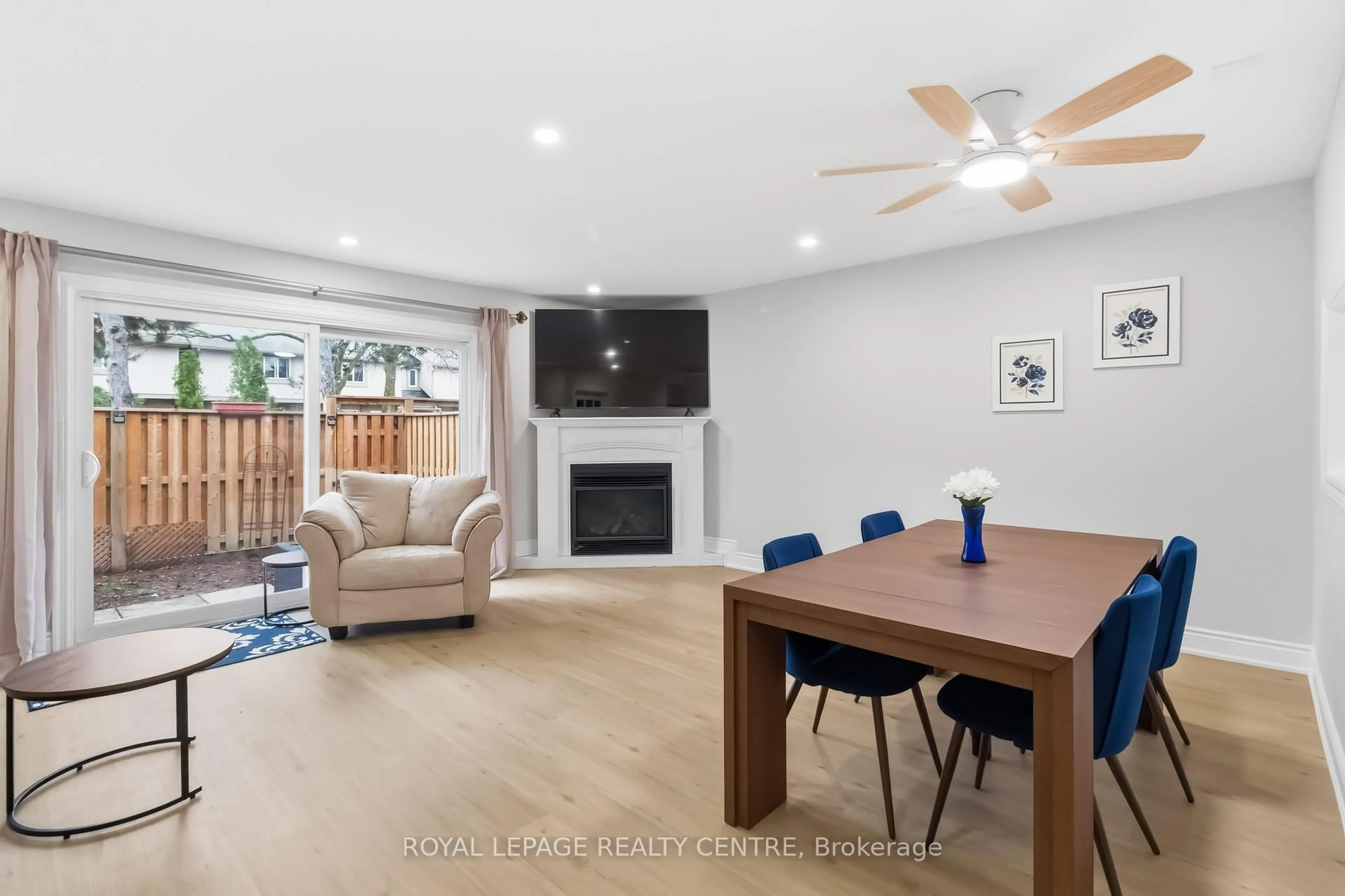 Living room with furniture, wood/laminate floor for 683 Woodward Ave, Milton Ontario L9T 3K4