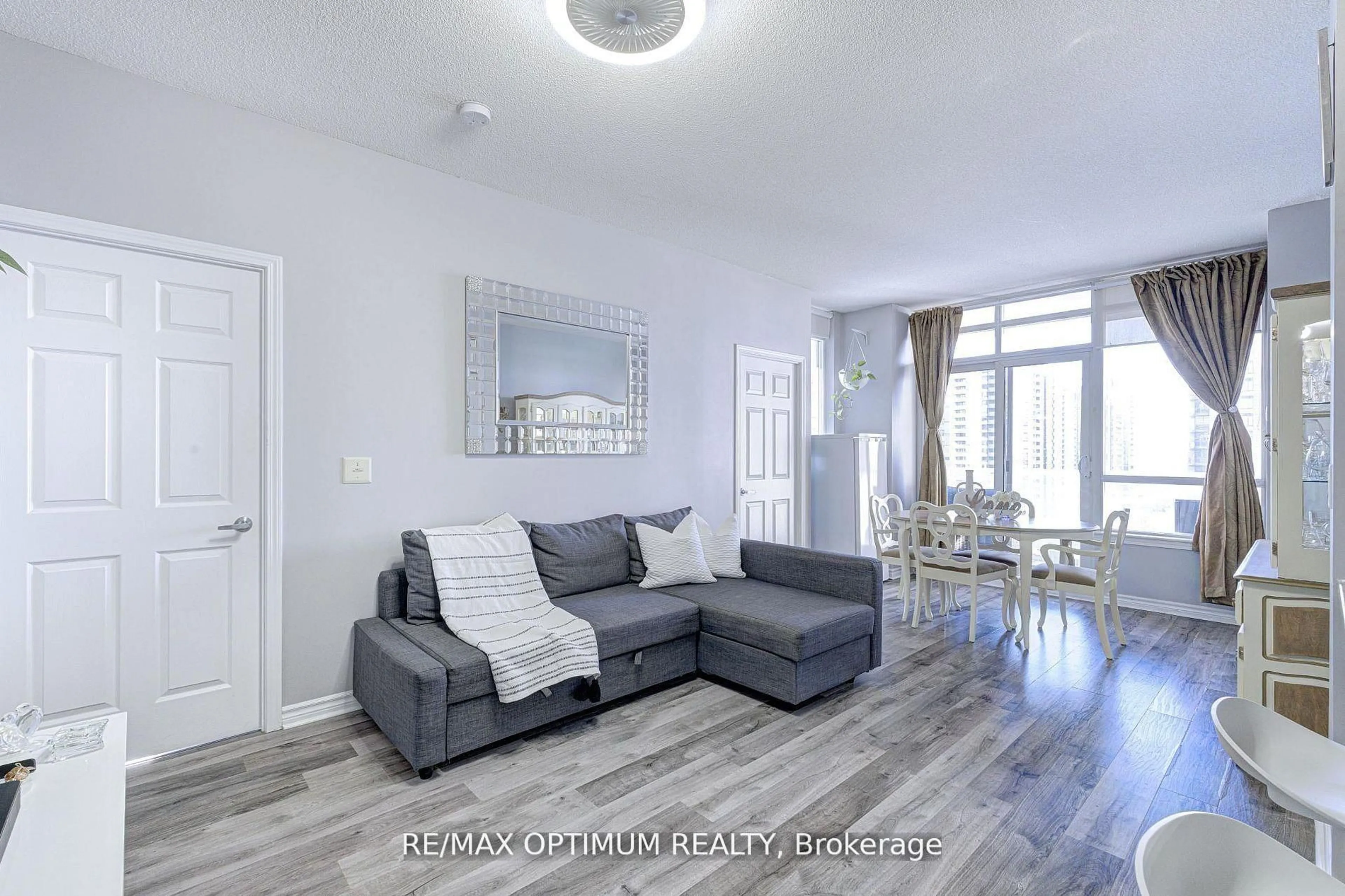 Living room with furniture, wood/laminate floor for 388 Prince Of Wales Dr #1104, Mississauga Ontario L5B 0A1