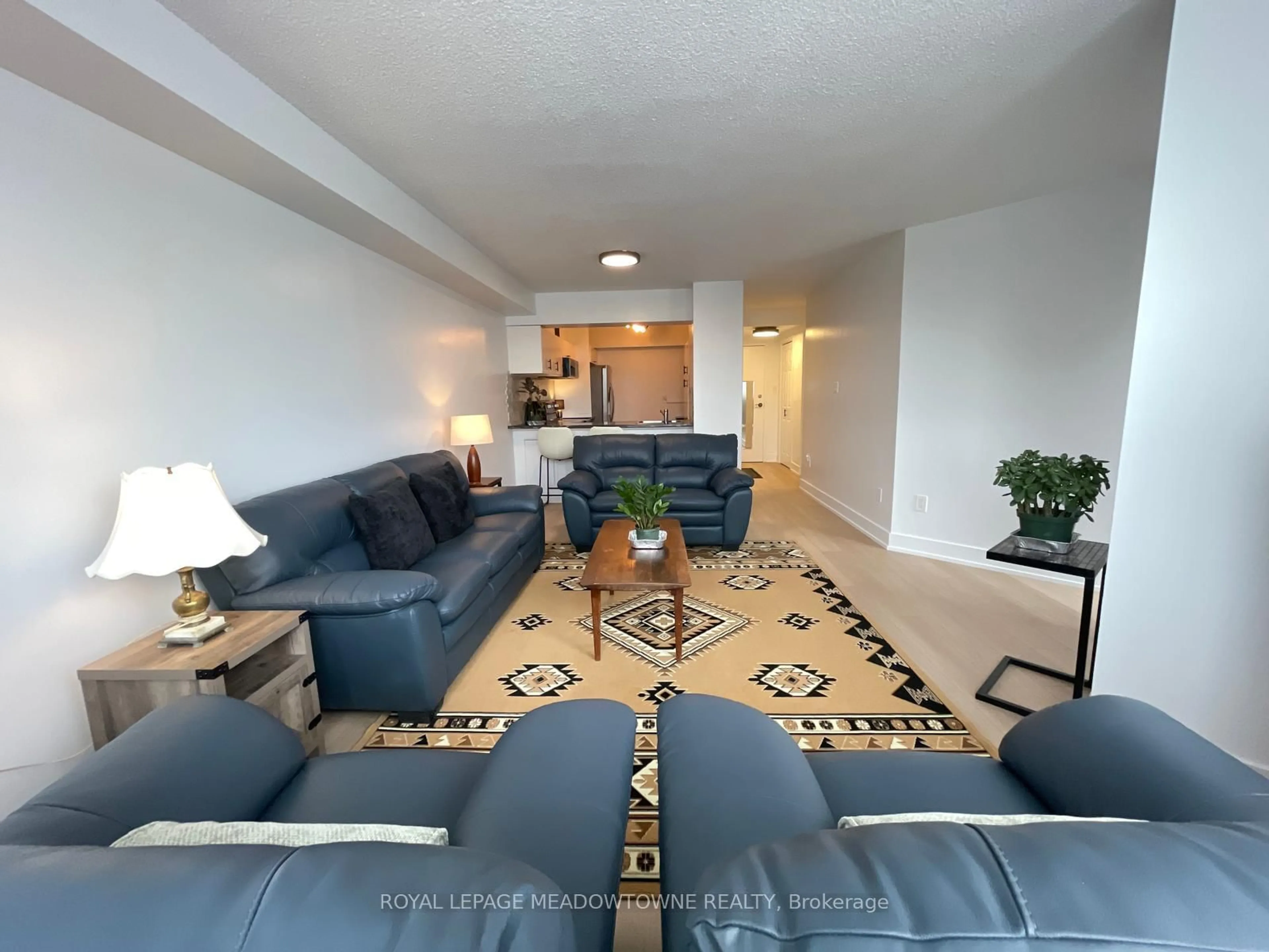 Living room with furniture, carpet floor for 236 Albion Rd ##309, Toronto Ontario M9W 6A6
