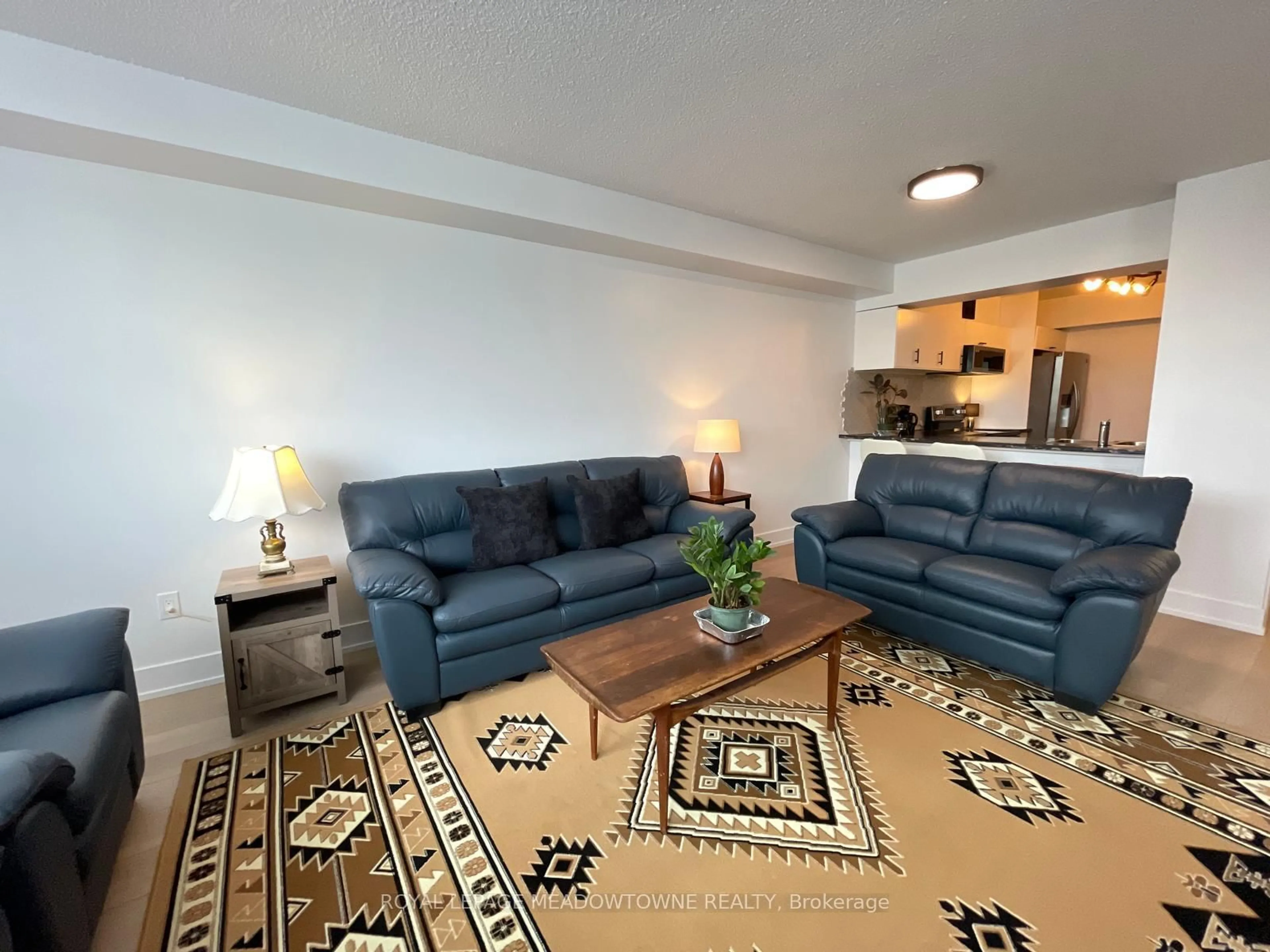 Living room with furniture, carpet floor for 236 Albion Rd ##309, Toronto Ontario M9W 6A6