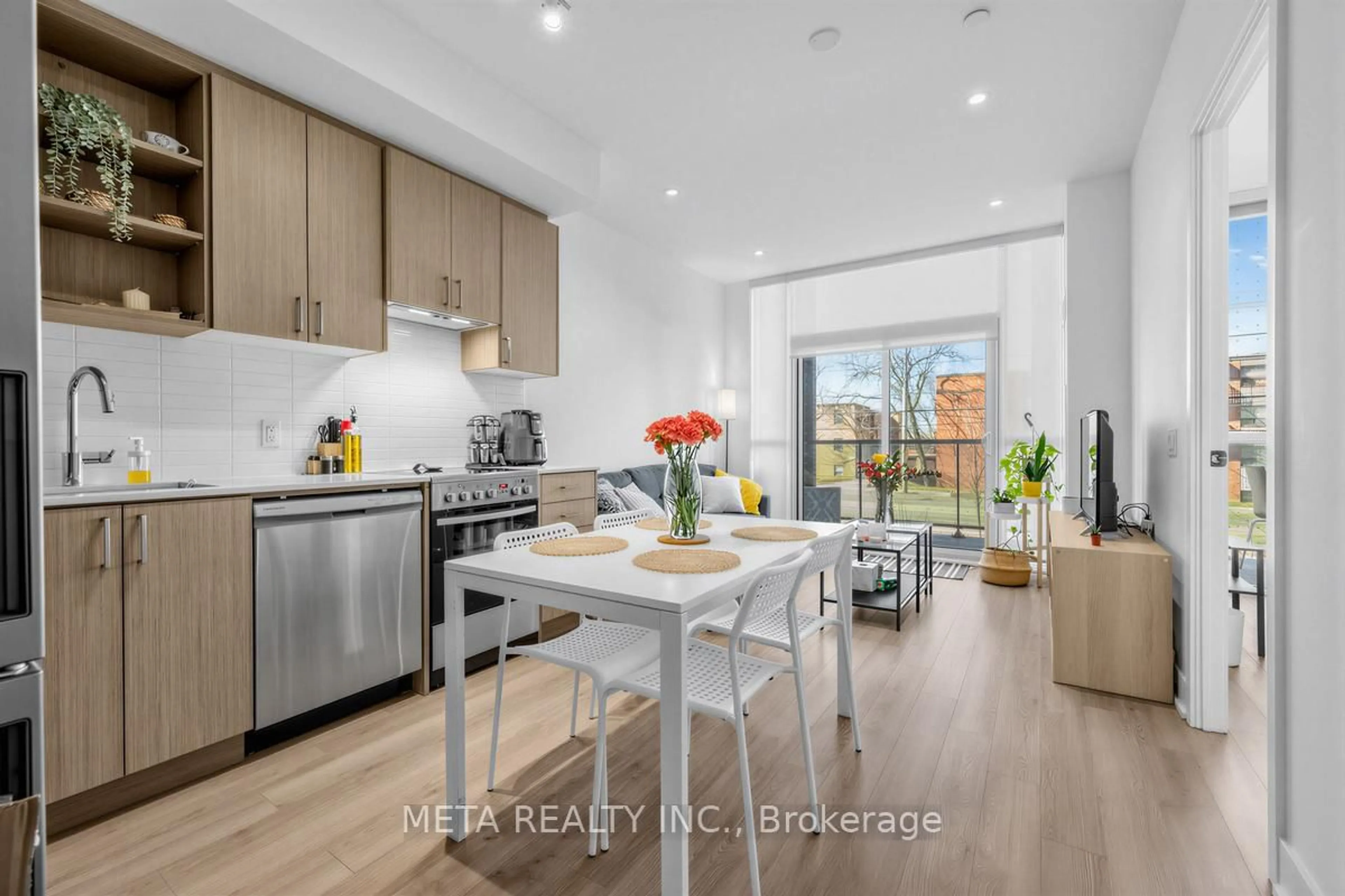 Open concept kitchen, wood/laminate floor for 50 George Butchart Dr #108, Toronto Ontario M3K 0C9