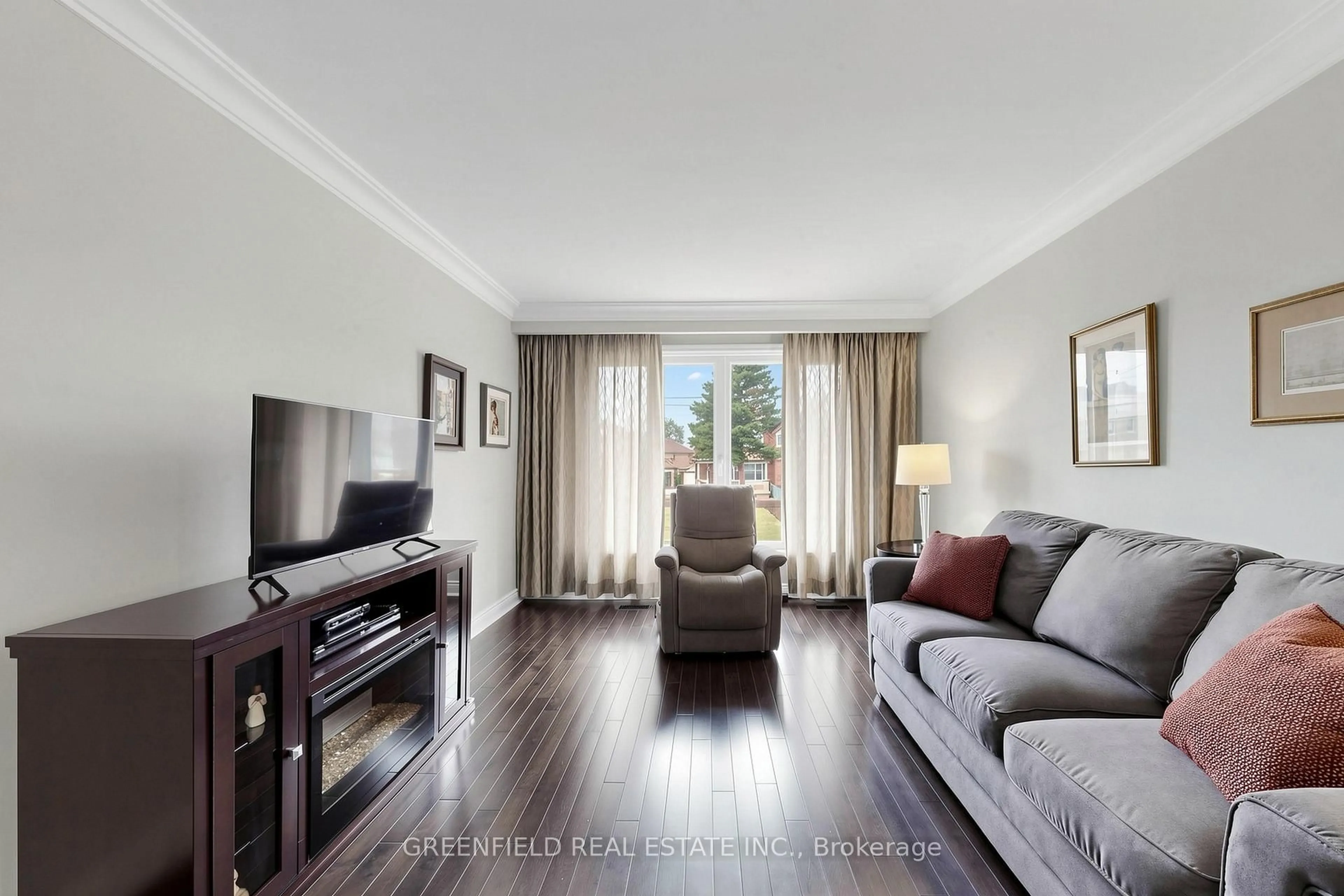 Living room with furniture, wood/laminate floor for 87 Mulholland Ave, Toronto Ontario M6A 2S5