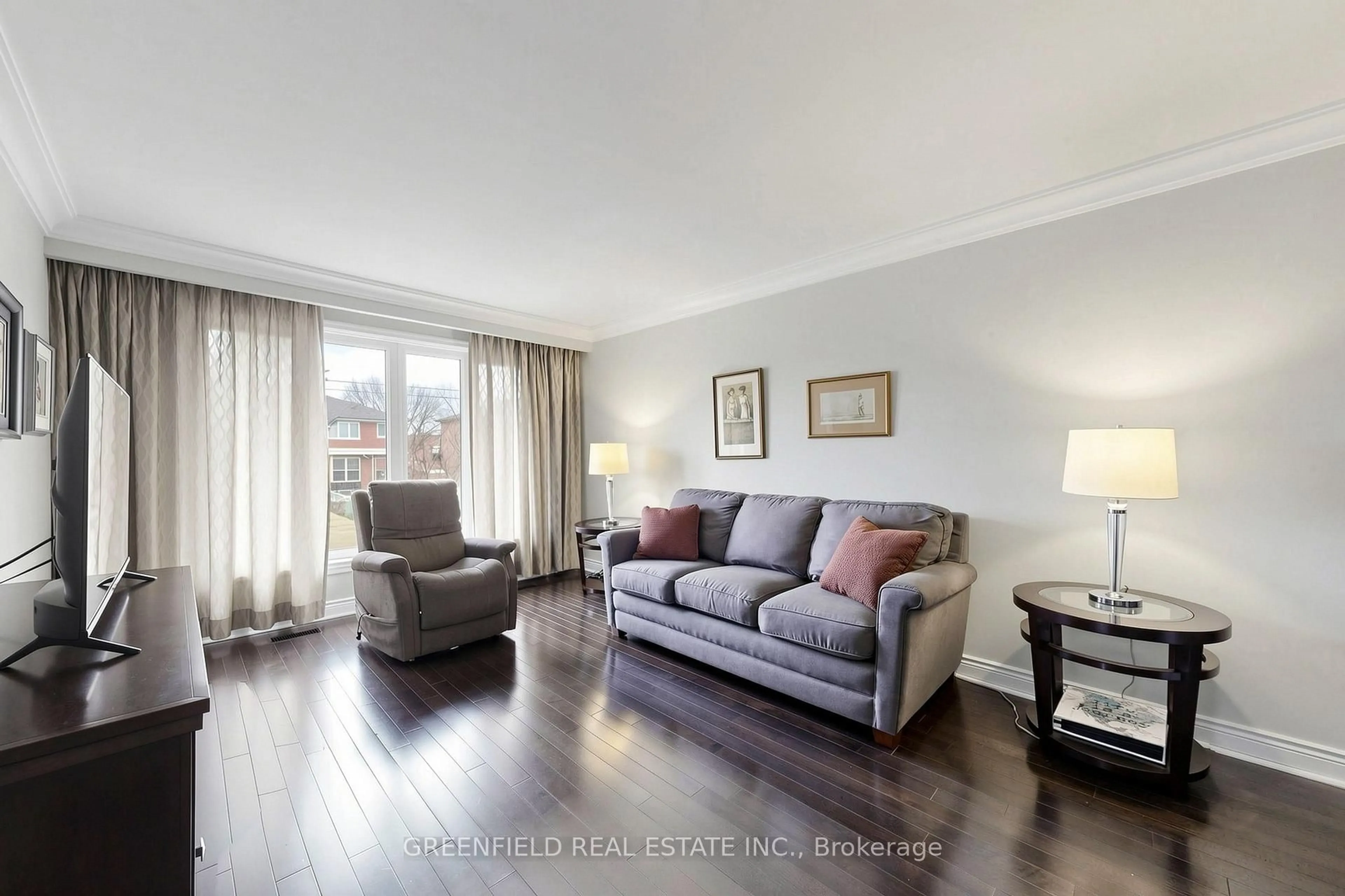 Living room with furniture, wood/laminate floor for 87 Mulholland Ave, Toronto Ontario M6A 2S5