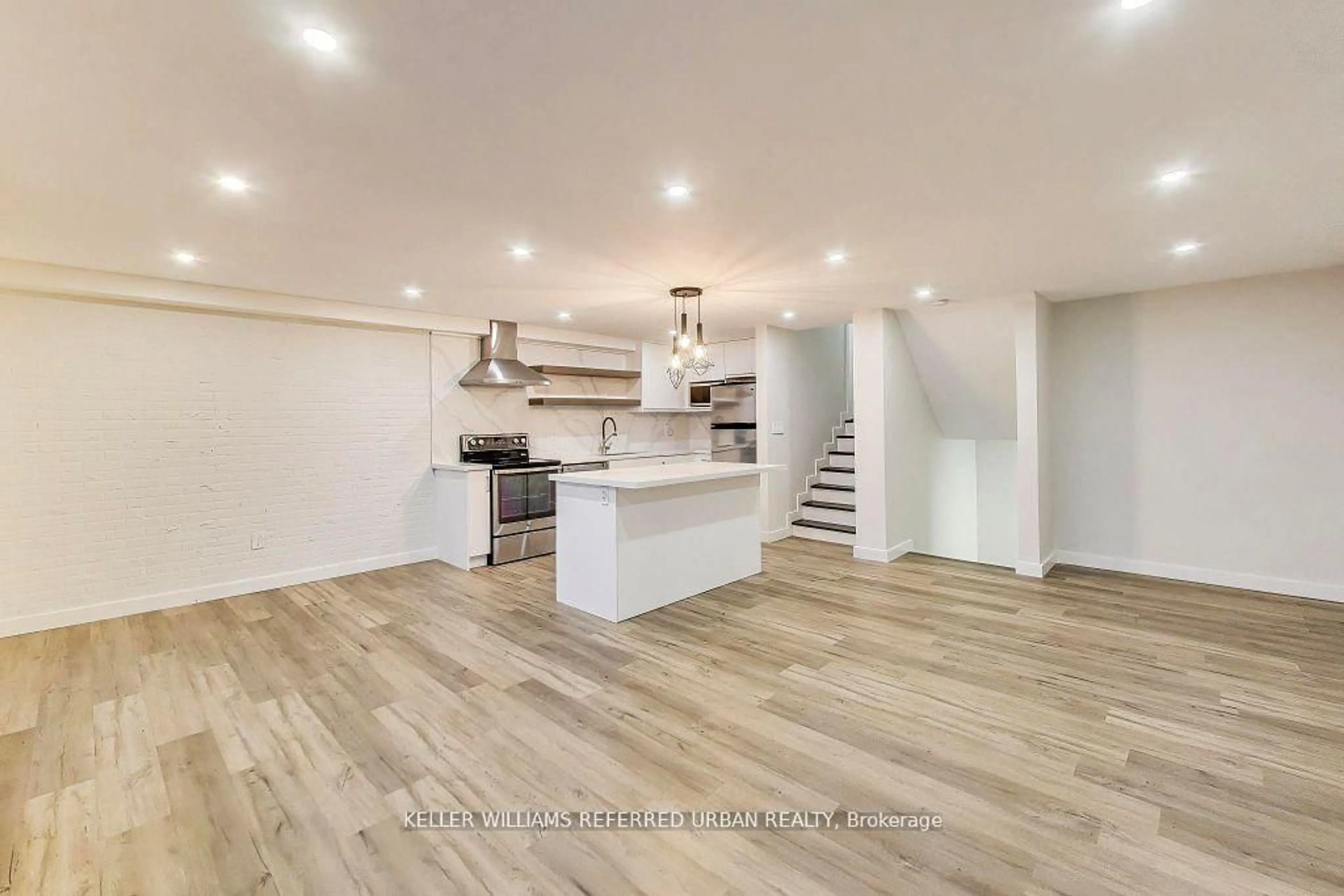 Open concept kitchen, wood/laminate floor for 11 Wincott Dr #1215, Toronto Ontario M9R 2R9