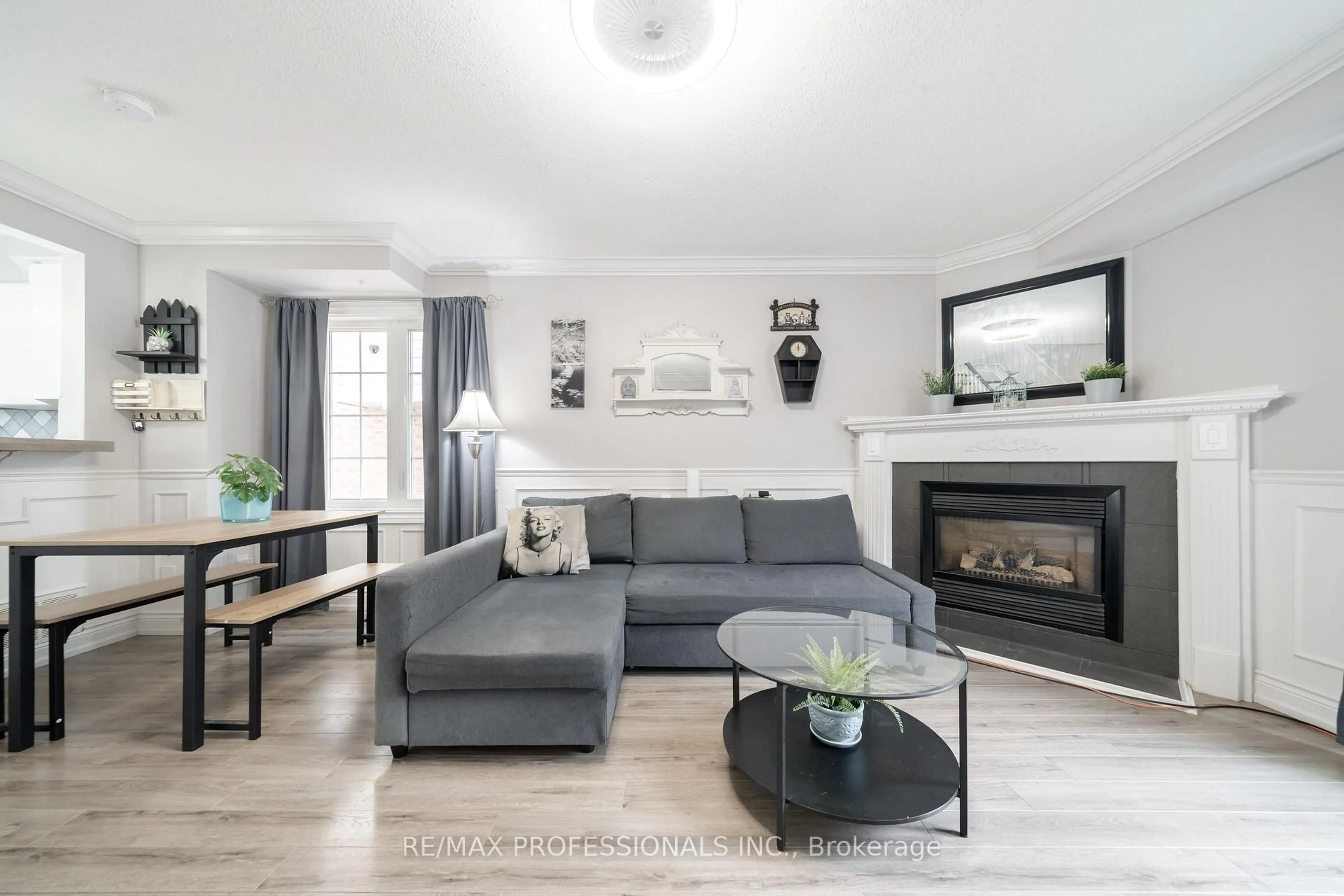 Living room with furniture, wood/laminate floor for 3480 Upper Middle Rd #12, Burlington Ontario L7M 4R8