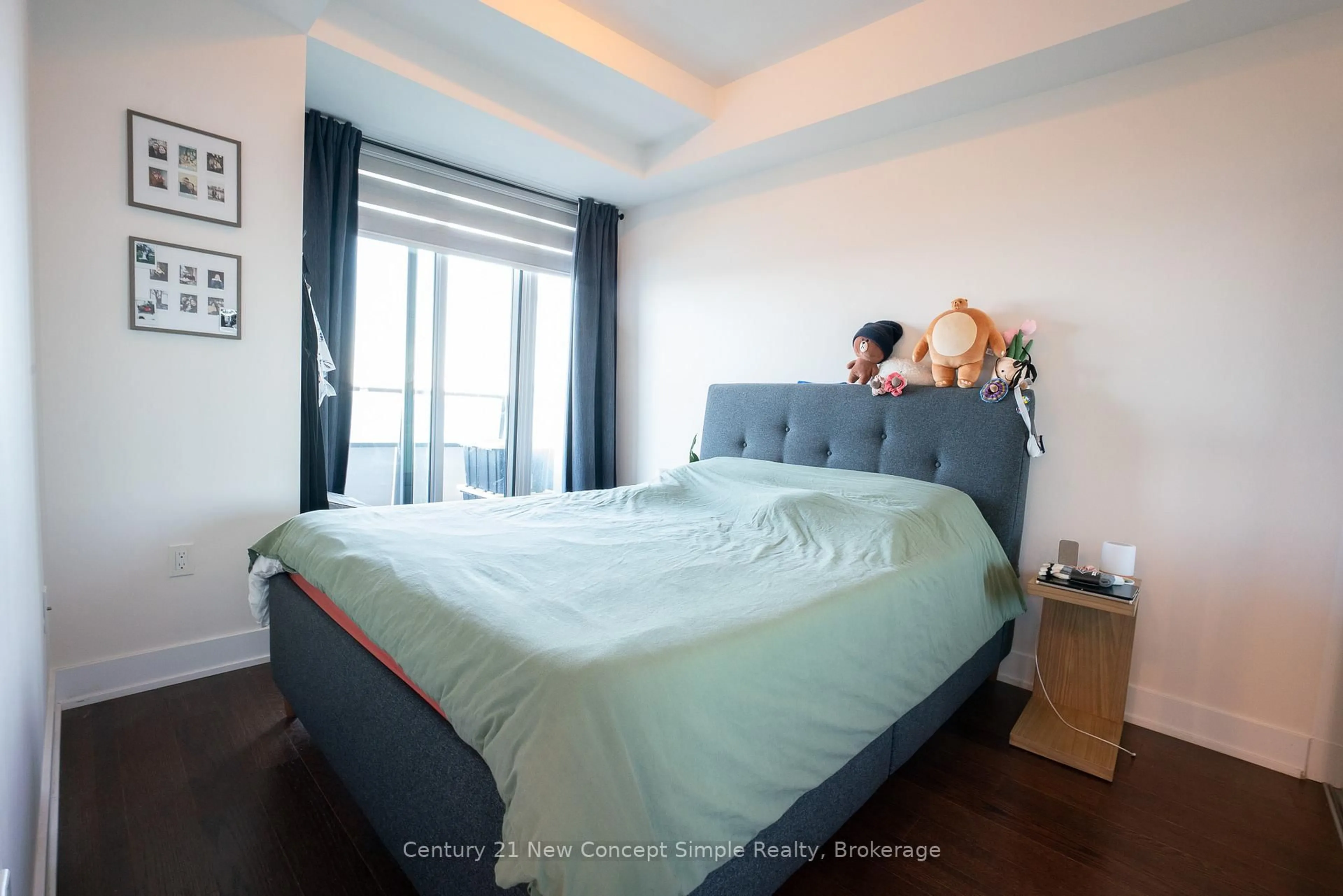 Bedroom with bed, wood/laminate floor for 20 Shore Breeze Dr #1209, Toronto Ontario M8V 0C7
