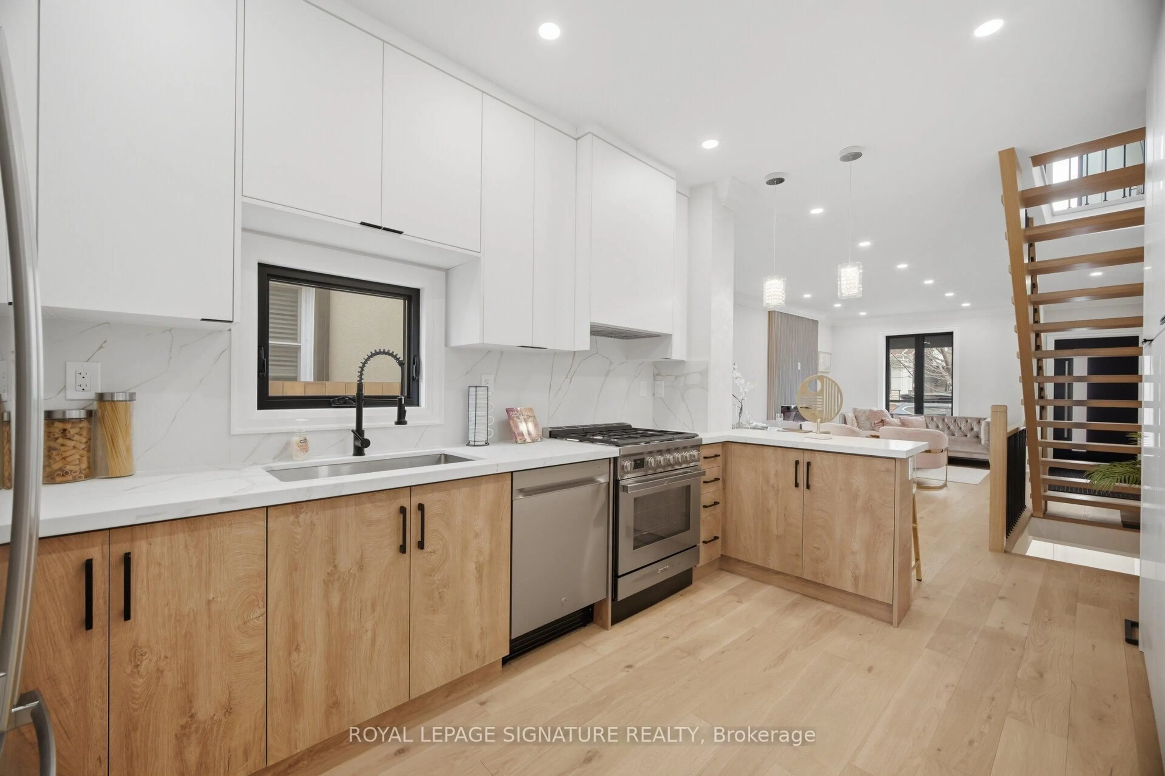 Open concept kitchen, wood/laminate floor for 241 Maria St, Toronto Ontario M6P 1W6