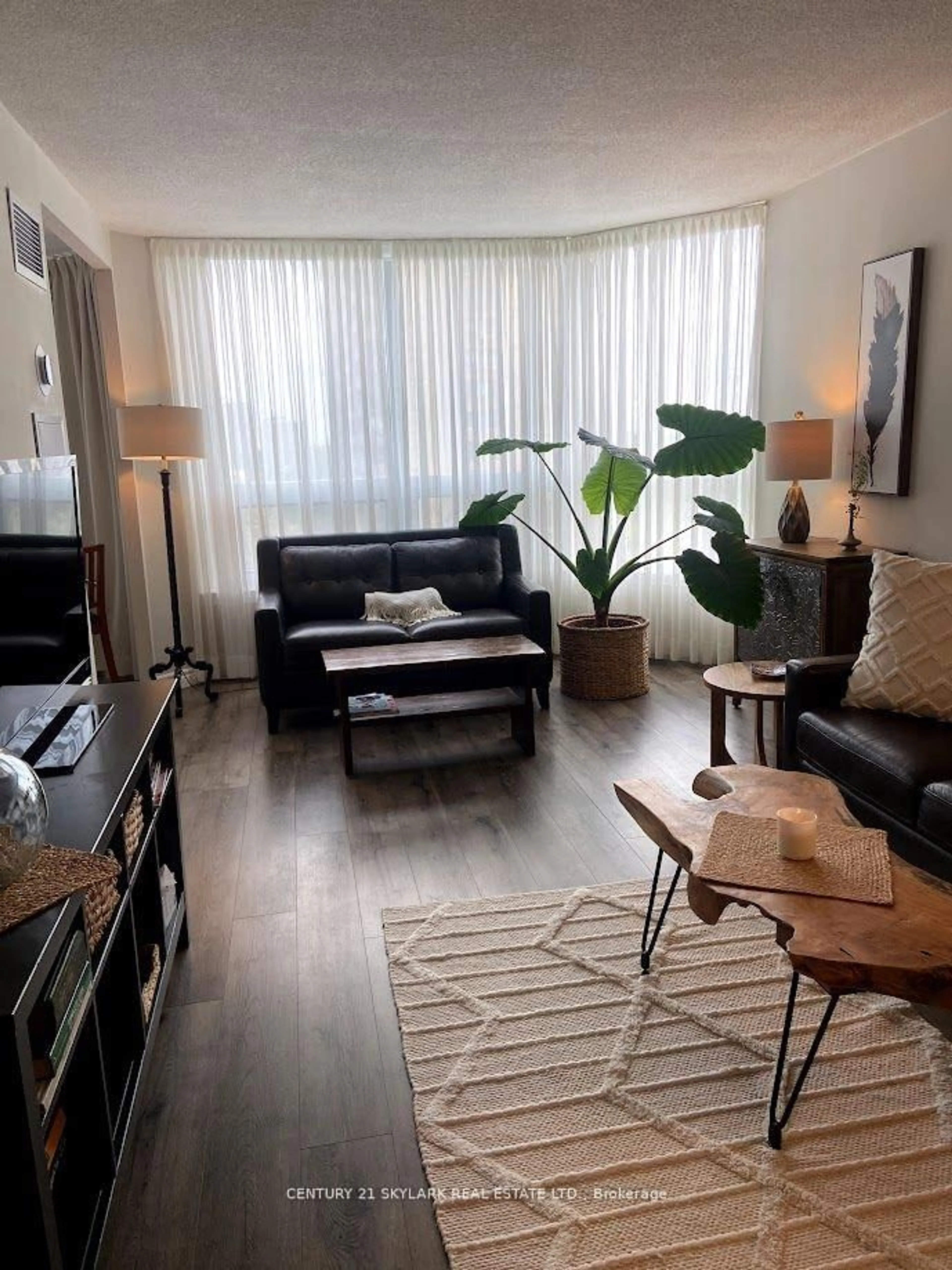 Living room with furniture, wood/laminate floor for 8 Lisa St #706, Brampton Ontario L6Y 3V1