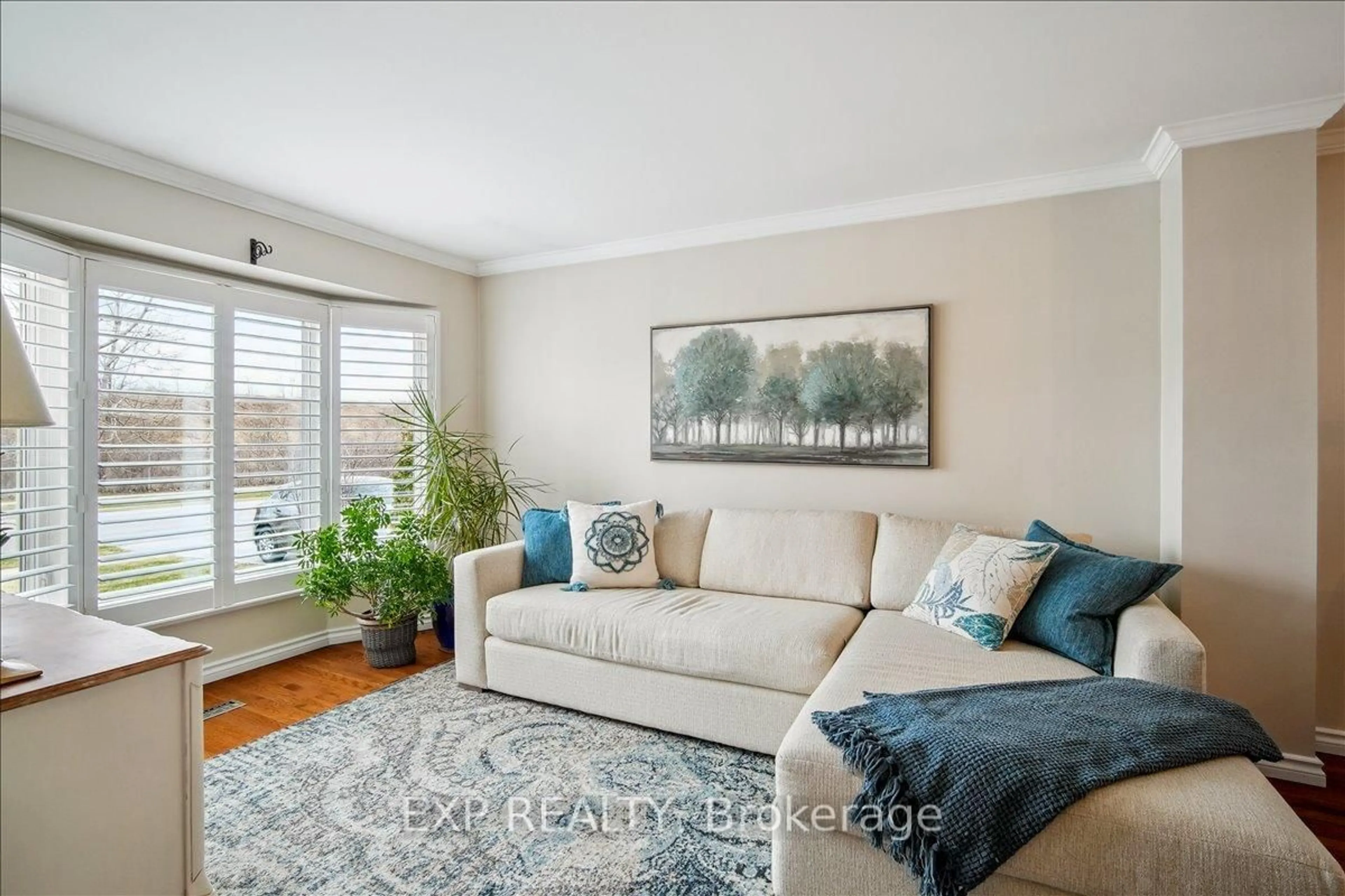 Living room with furniture, wood/laminate floor for 2417 Headon Forest Dr, Burlington Ontario L7M 3K7