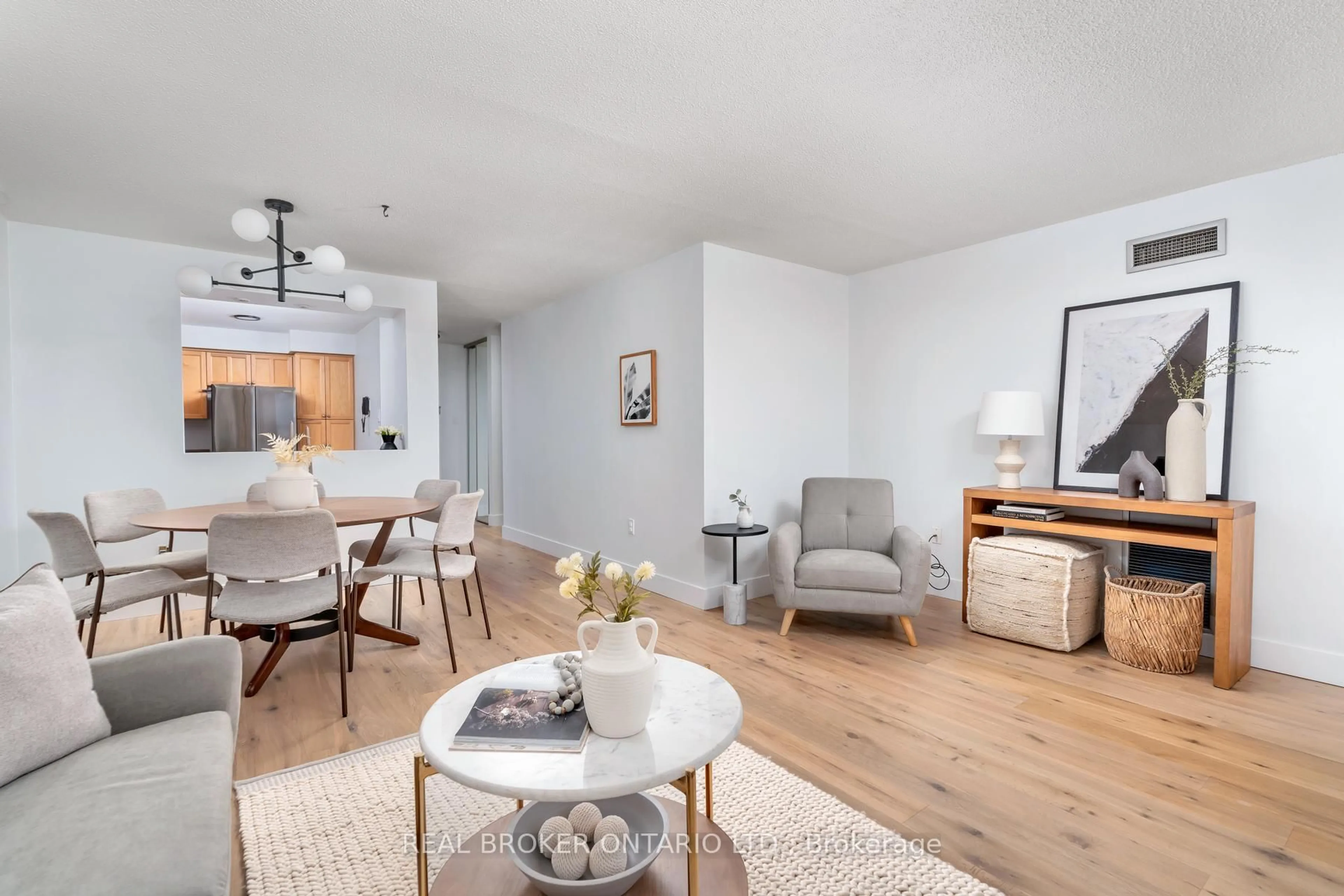 Living room with furniture, wood/laminate floor for 3845 Lake Shore Blvd #1601, Toronto Ontario M8W 4Y3